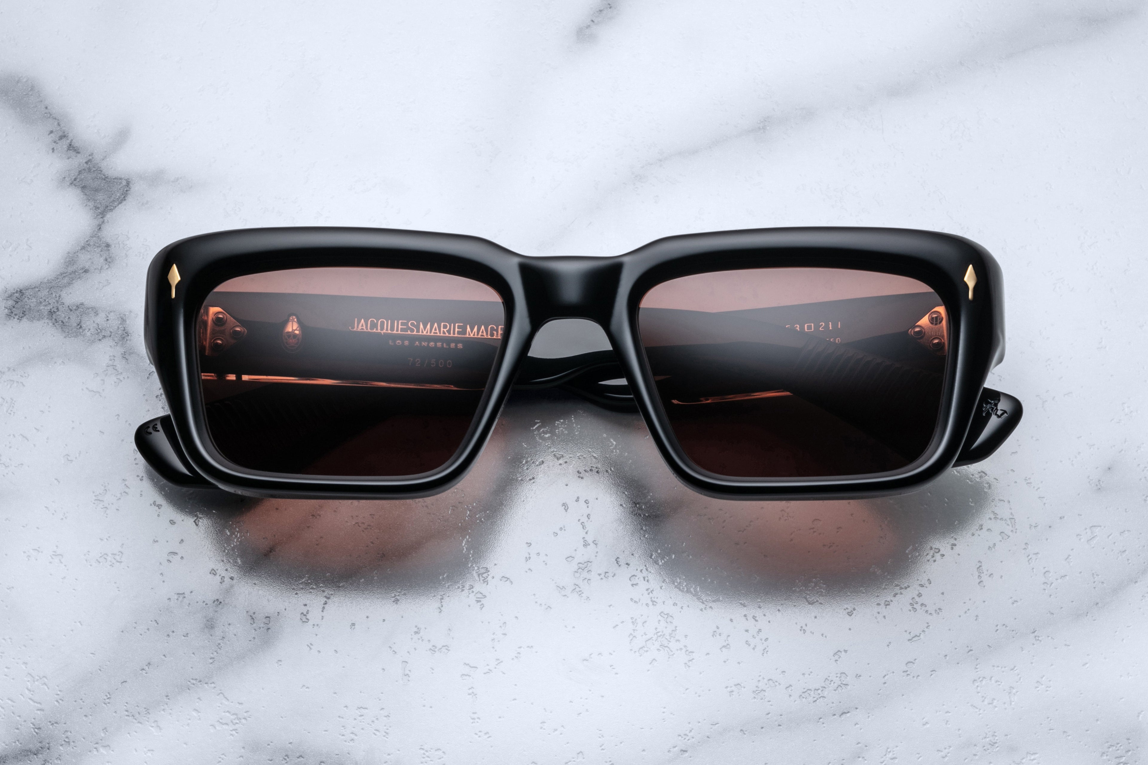 Jacques Marie Mage Walker Eclipse sunglasses with round black frames and dark tinted lenses, front view.