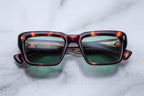 Jacques Marie Mage Walker sunglasses with Havana tortoiseshell frames and clear lenses, front view.