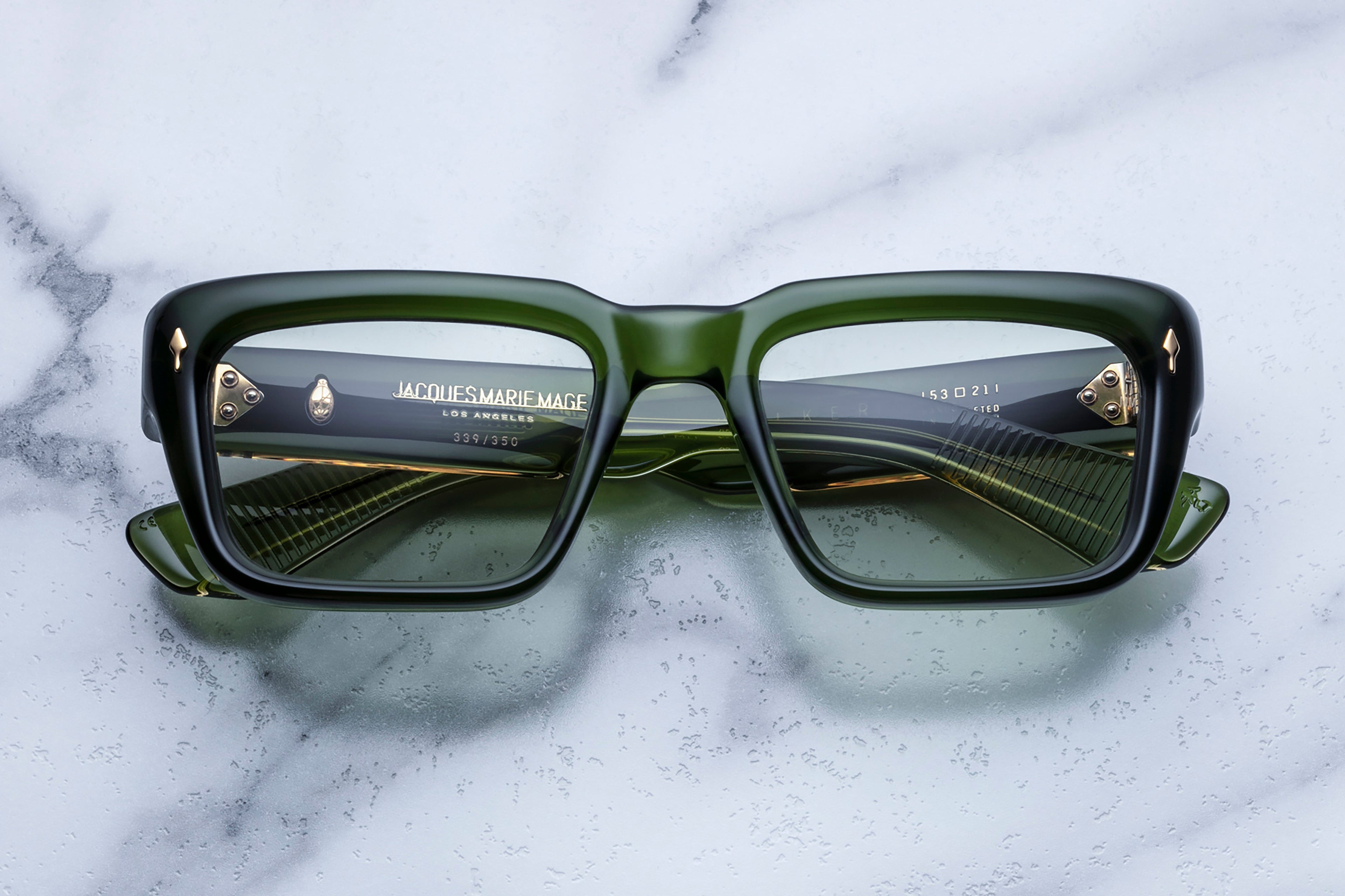 Jacques Marie Mage Walker Rover sunglasses with round frames and tinted lenses, shown from the front view.