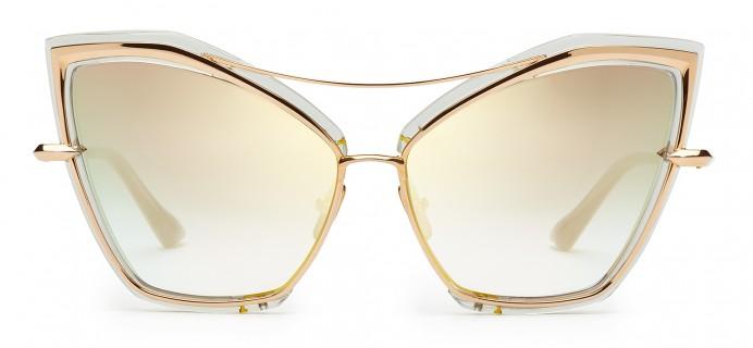 Close-up of DITA CREATURE sunglasses with gray and gold frames, showcasing the front view and sleek design.