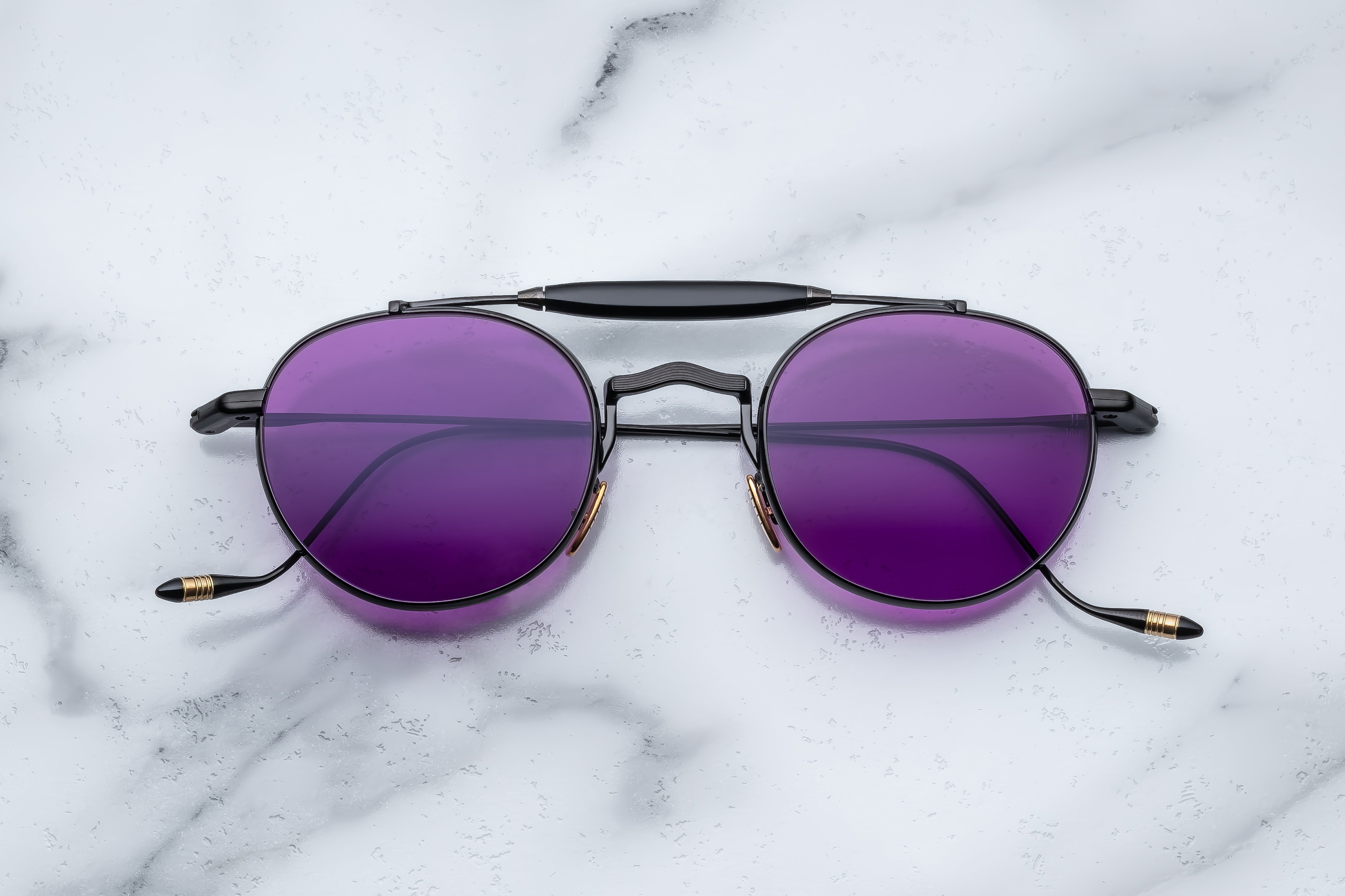 Jacques Marie Mage Dasan Spider sunglasses with black frames and tinted lenses, front view showing stylish design.