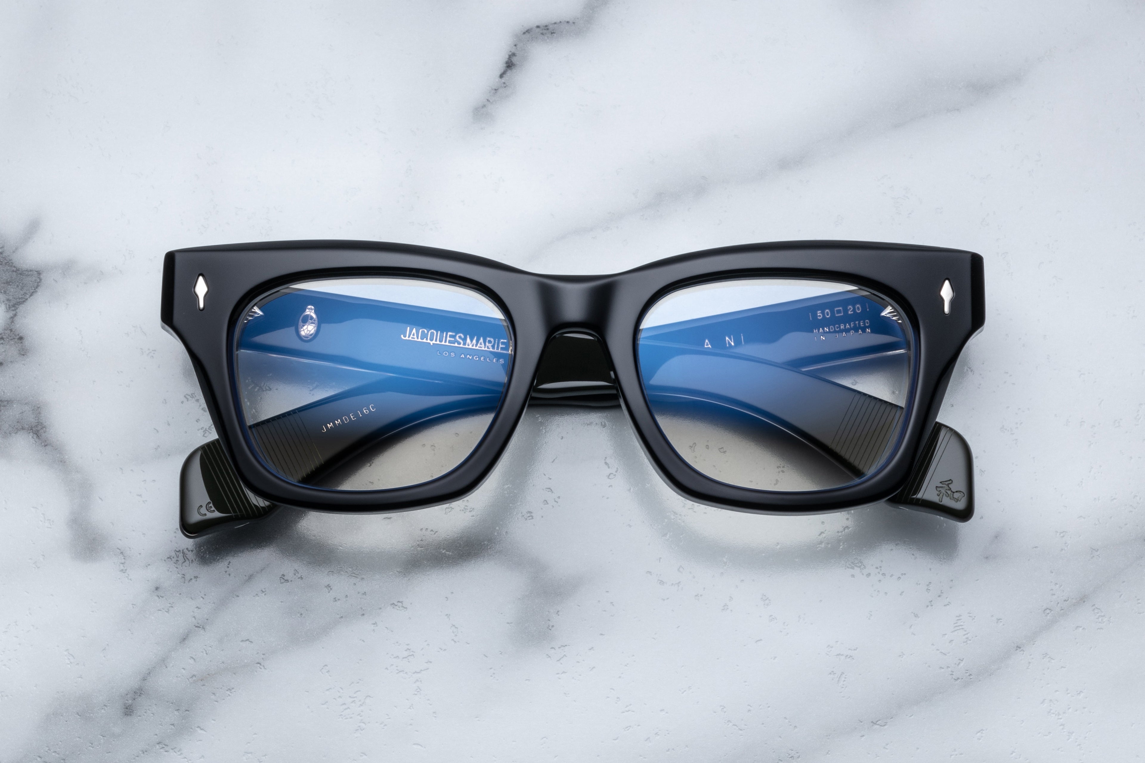 Optical ZEPHIRIN sunglasses by Jacques Marie Mage with sleek black frames and clear lenses, front view.