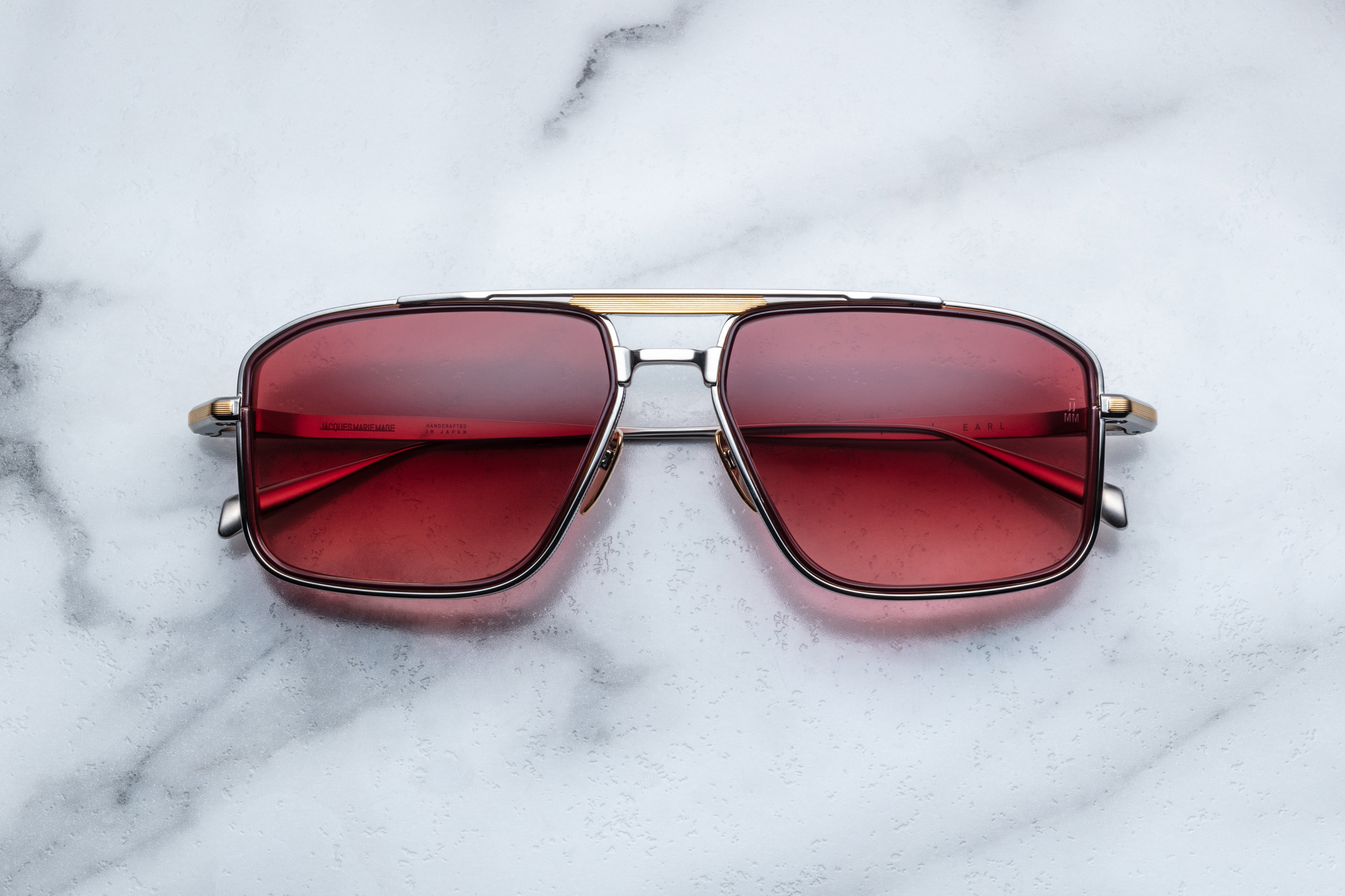 Jacques Marie Mage Earl Empire sunglasses with bold black frames and tinted lenses, front view showing stylish design.