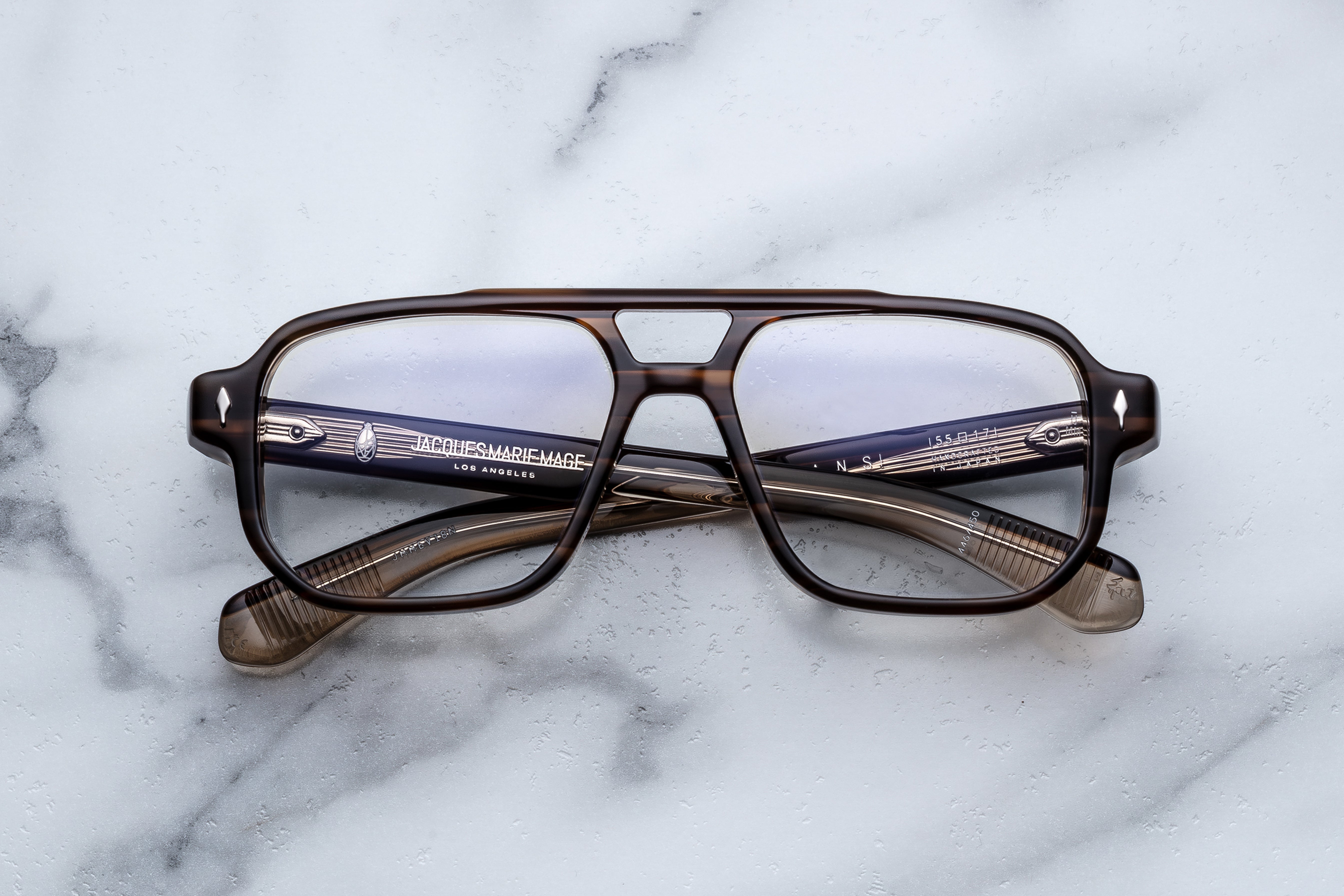 Jacques Marie Mage EVANS RX optical glasses with hazel-colored frames, front view showing sleek design and clear lenses.