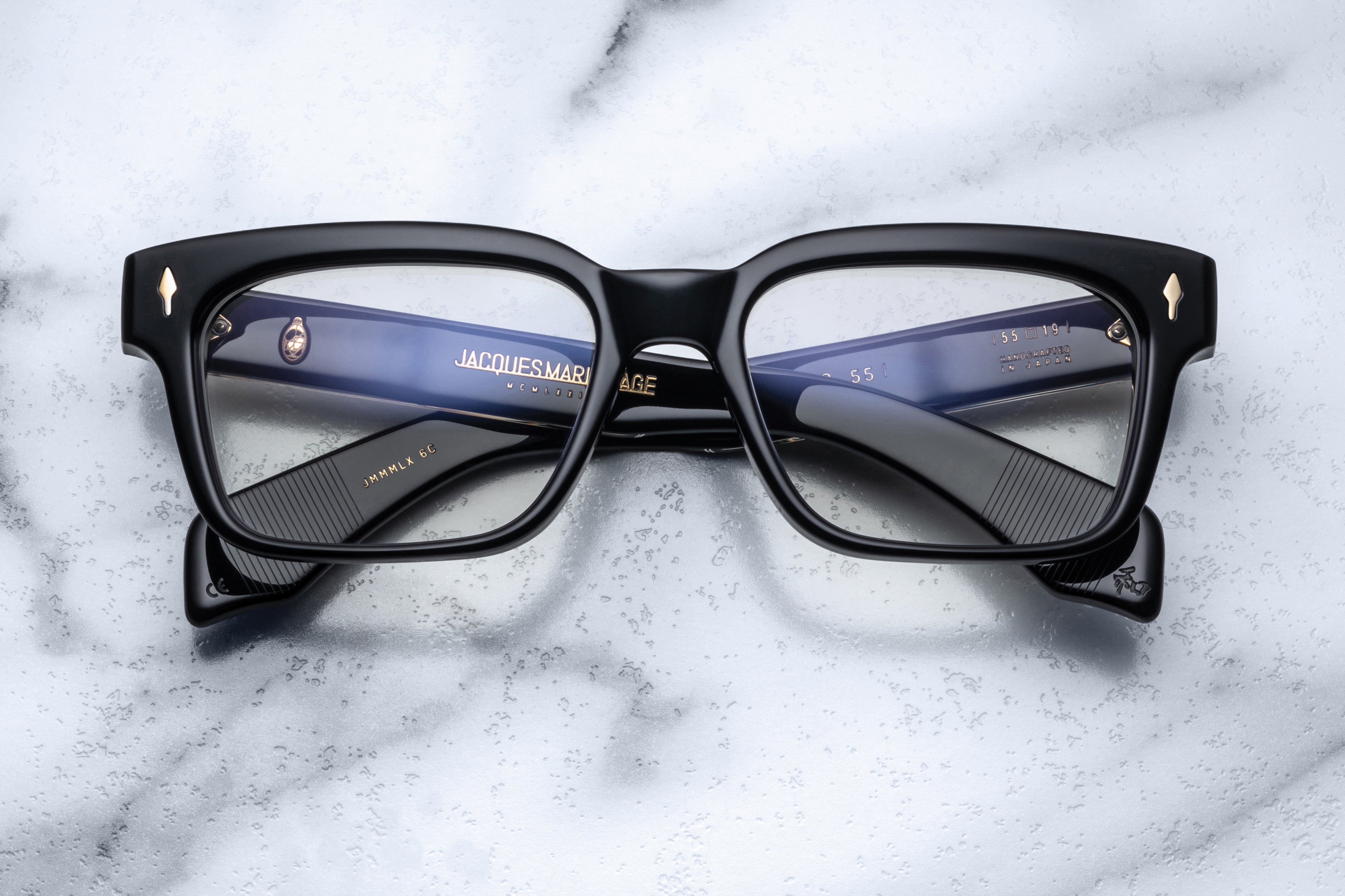 Jacques Marie Mage Molino 55 optical glasses with clear frames and black temples, showcasing sophisticated eyewear design and craftsmanship.