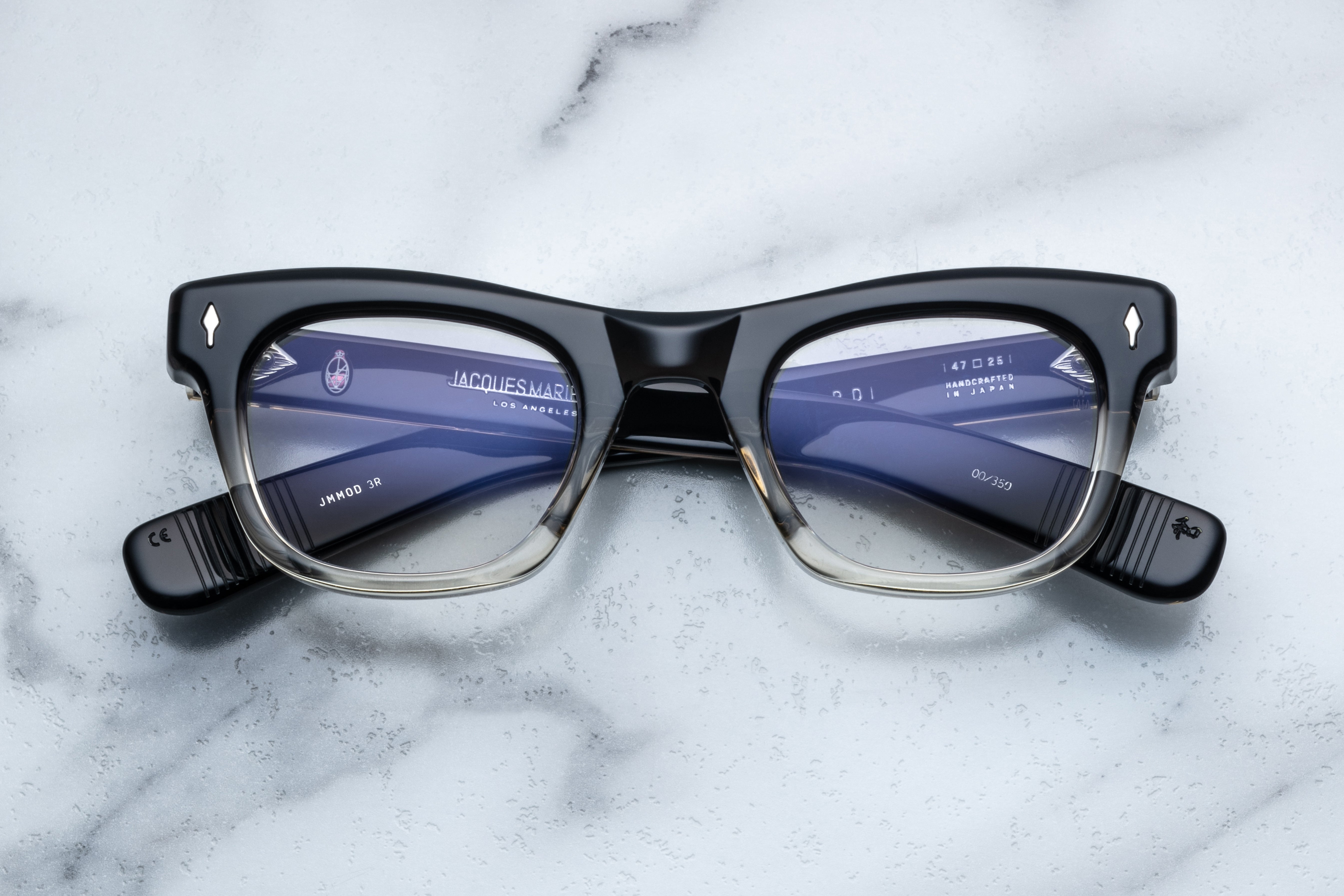 Jacques Marie Mage Godard optical glasses with black fade frame, front view showing sleek design and clear lenses.