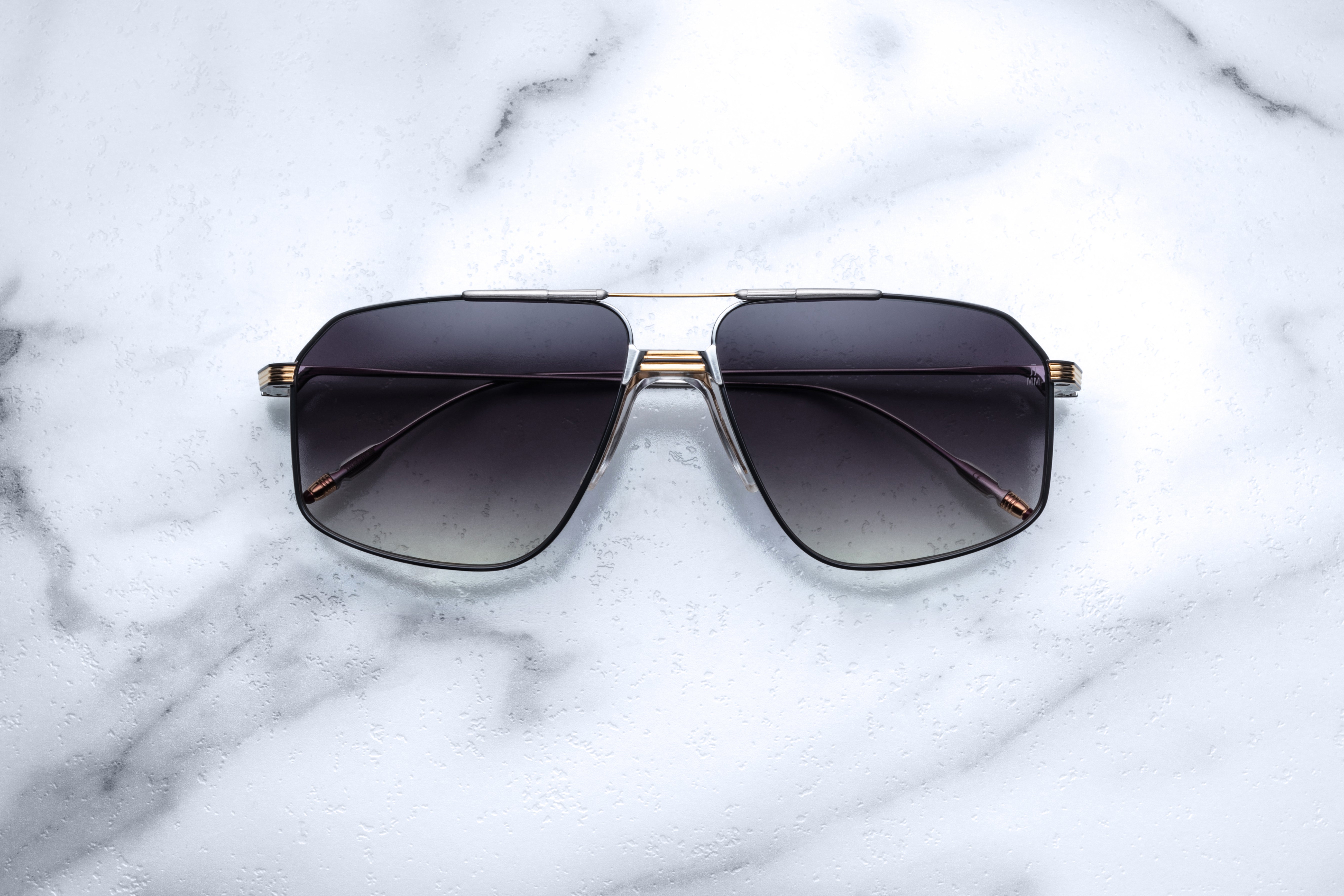Jacques Marie Mage JAGGER sunglasses with sleek metal frames and tinted lenses, front view showing stylish design.