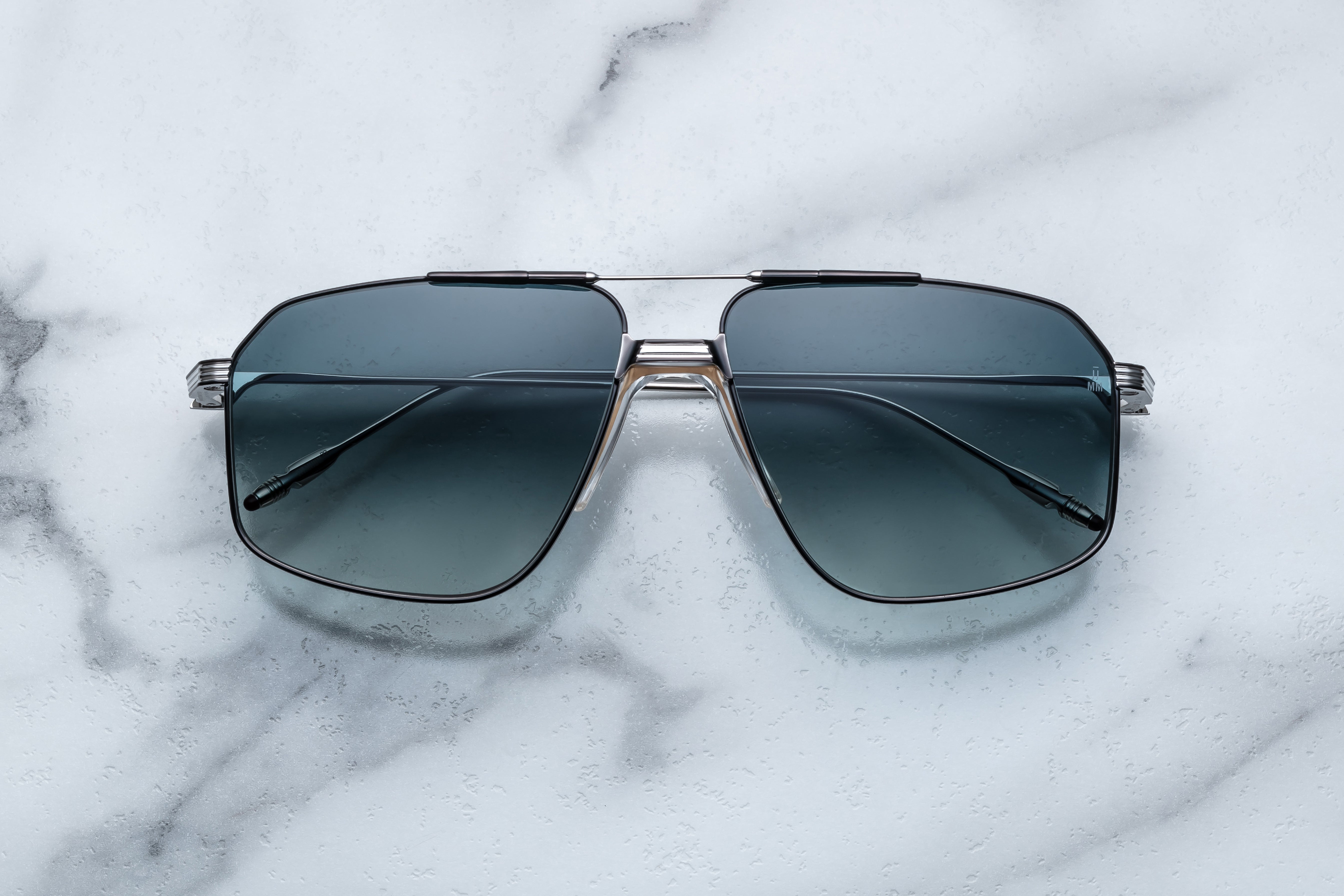 Jacques Marie Mage Jagger sunglasses with rounded frames and dark lenses, front view showing sleek design and premium craftsmanship.
