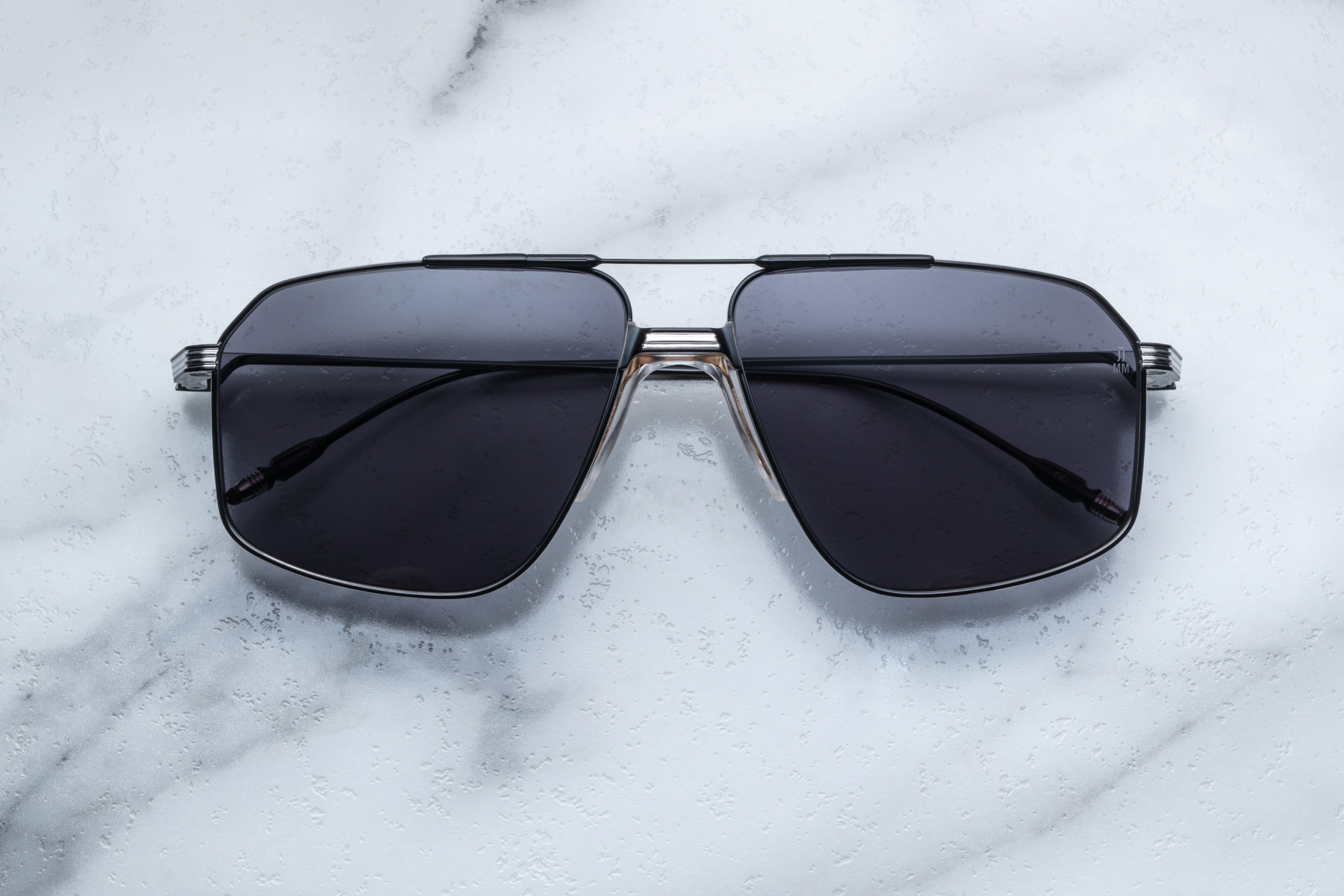 Jacques Marie Mage JAGGER sunglasses with bold black frames and tinted lenses, front view showcasing stylish design.