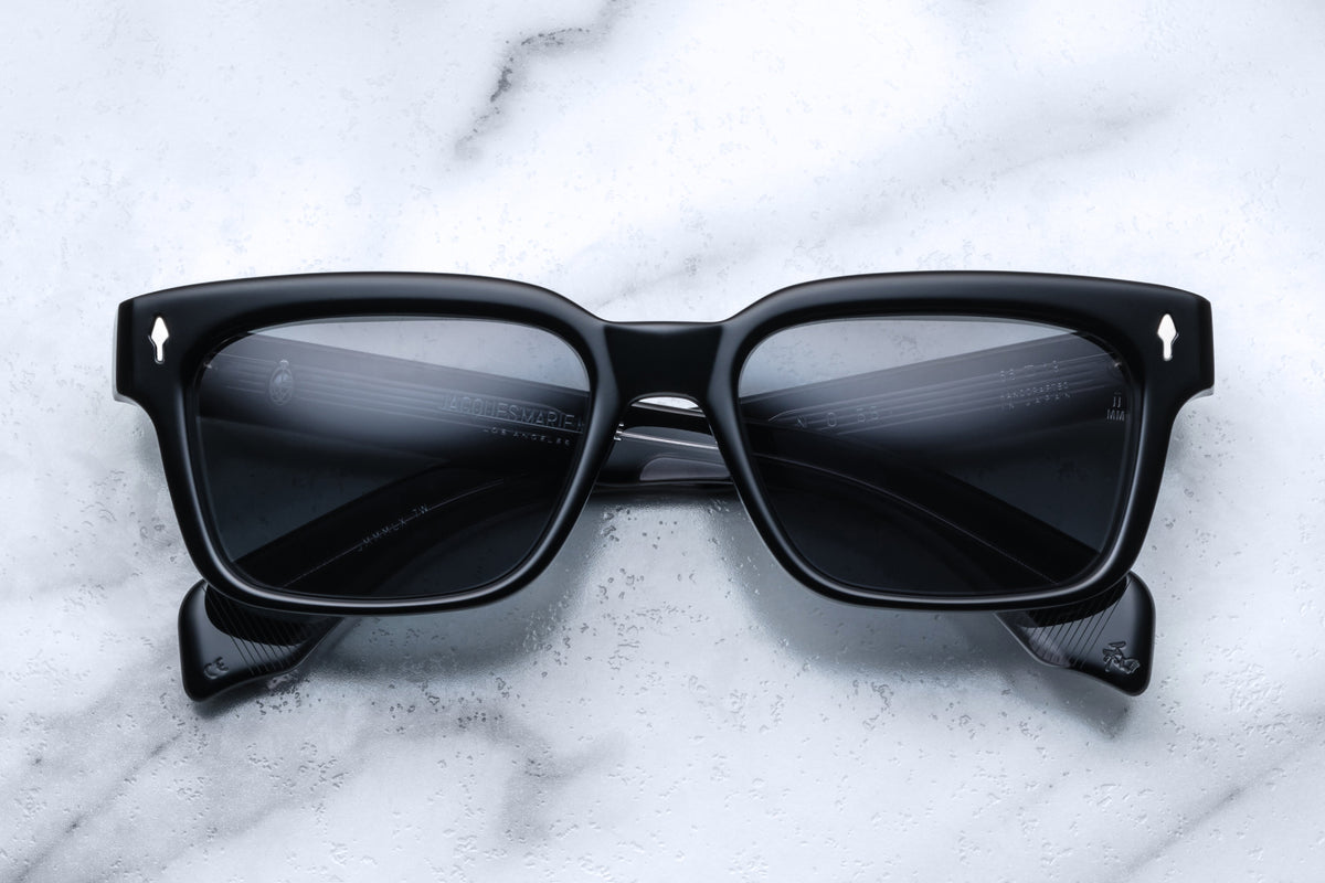 Jacques Marie Mage Molino 55 sunglasses featuring a sleek frame and clear lenses, shown from the front.