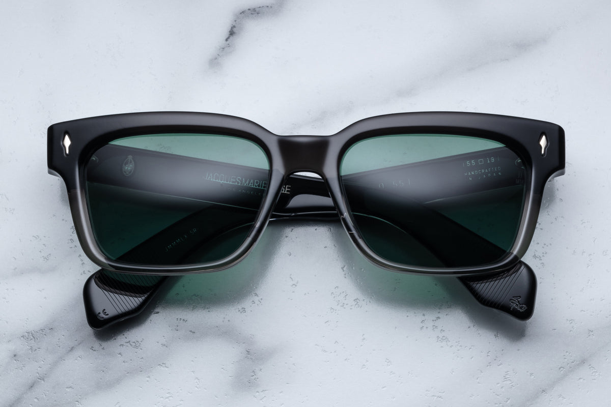 Jacques Marie Mage Molino 55 sunglasses with black fade frames, front view showing sleek design and tinted lenses.