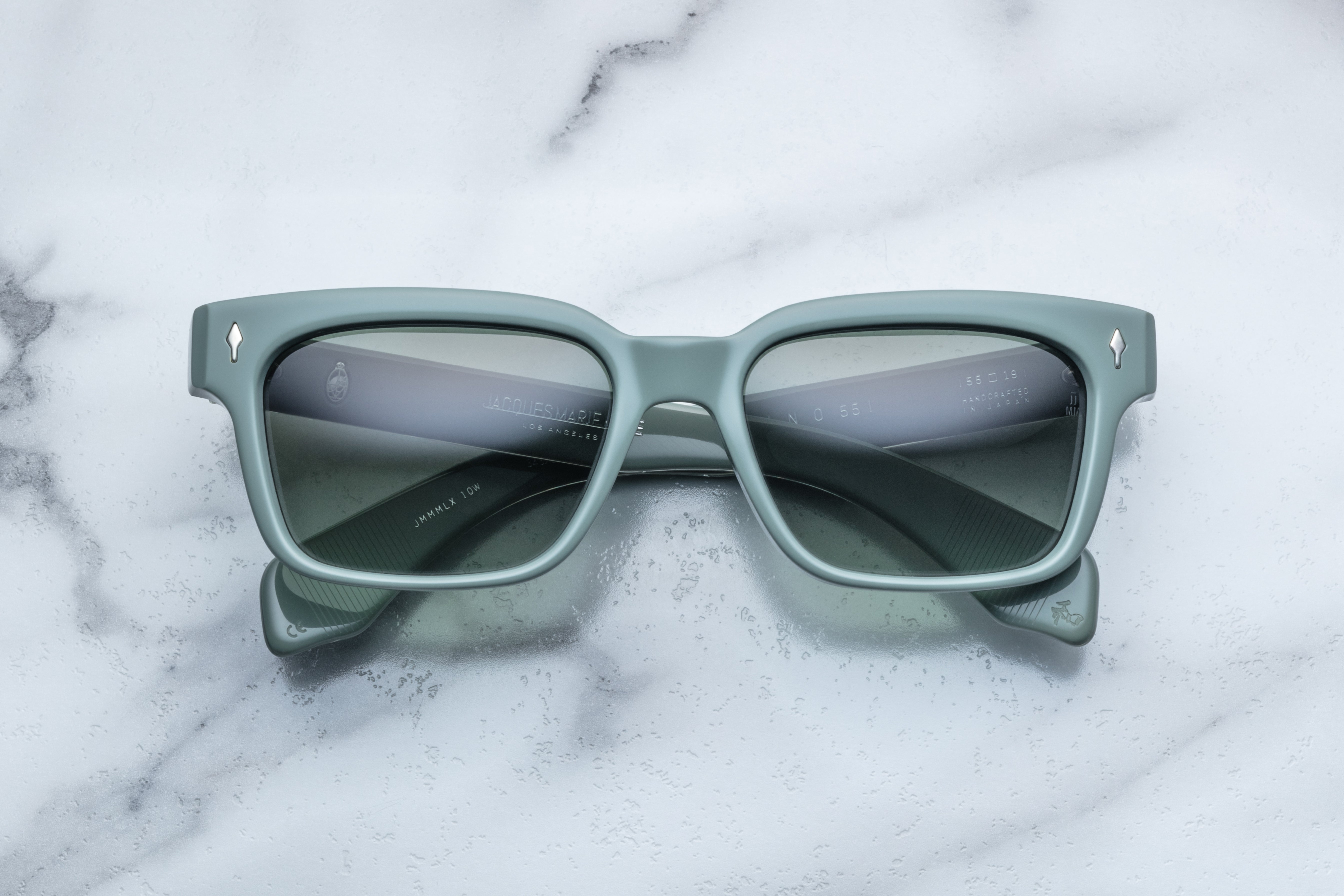 Jacques Marie Mage Molino 55 sunglasses with bold, rectangular frames and clear lenses, shown from the front view.