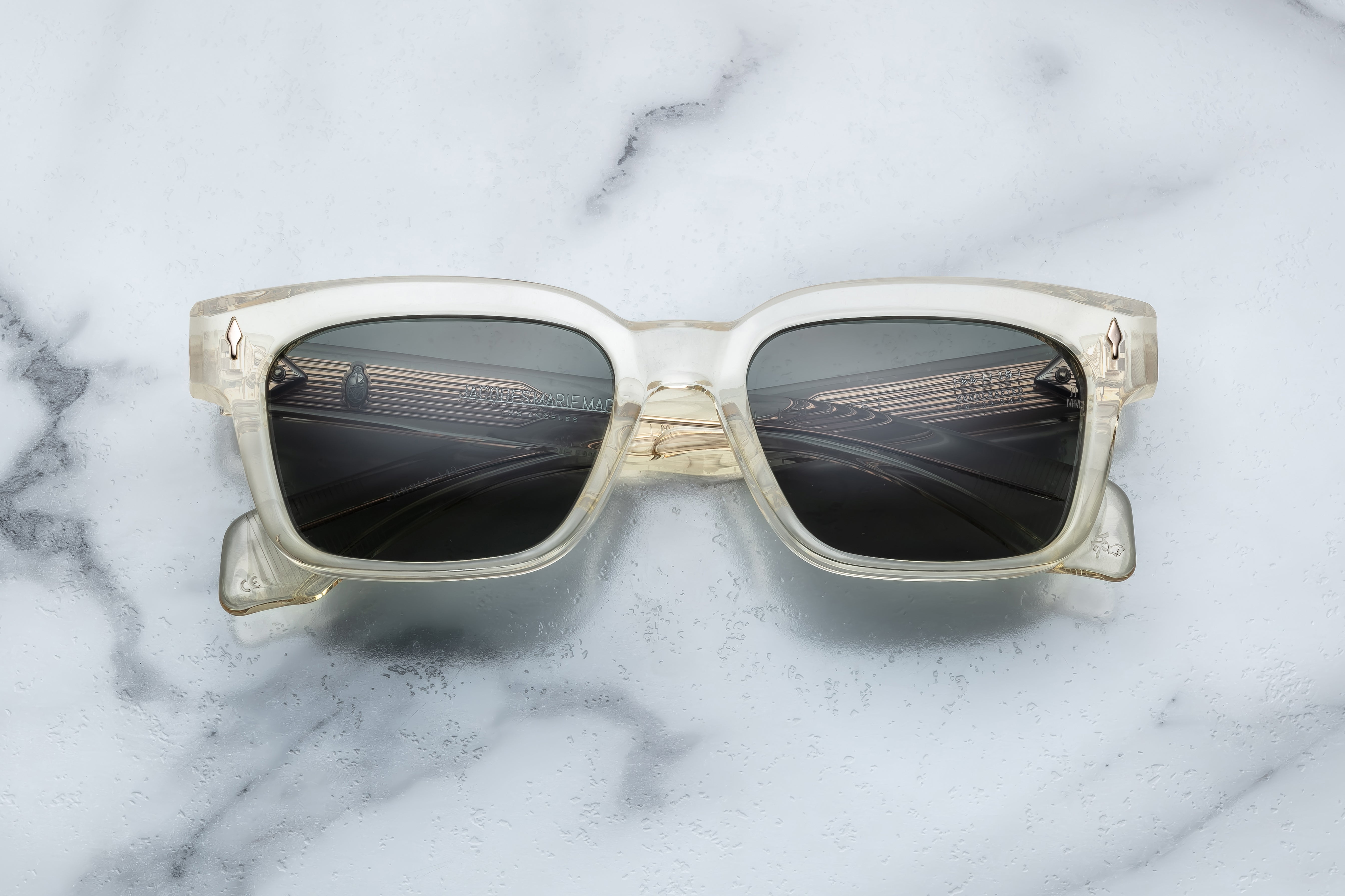 Jacques Marie Mage Molino 55 sunglasses with bold, rectangular frames and dark lenses, front view.