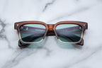 Jacques Marie Mage Molino 55 sunglasses with hickory fade frames and clear lenses, front view showing stylish design.