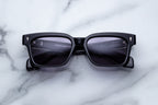 Jacques Marie Mage Molino 55 sunglasses with rounded frames and tinted lenses, shown from the front view.