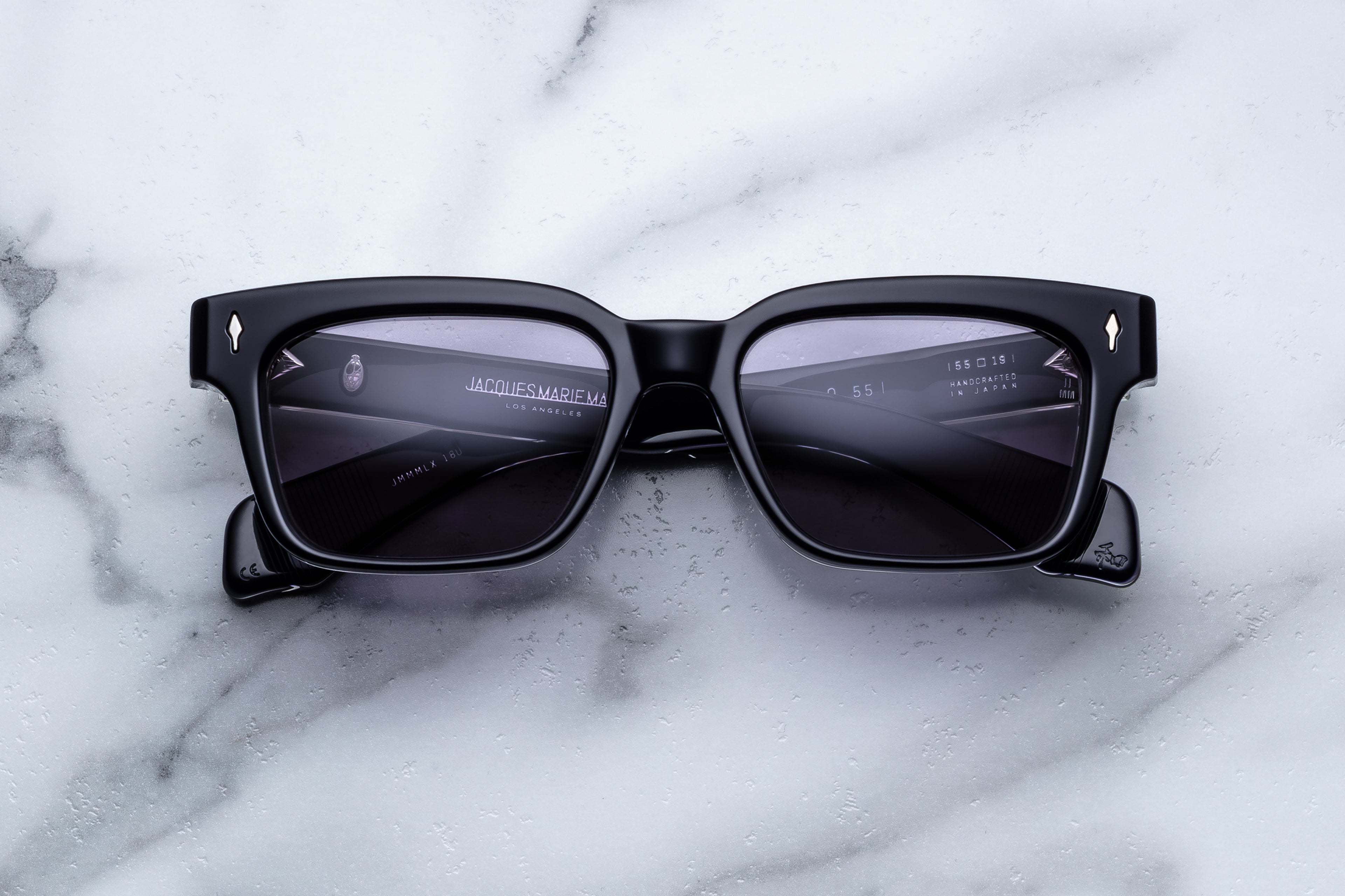 Jacques Marie Mage Molino 55 sunglasses with rounded frames and tinted lenses, shown from the front view.
