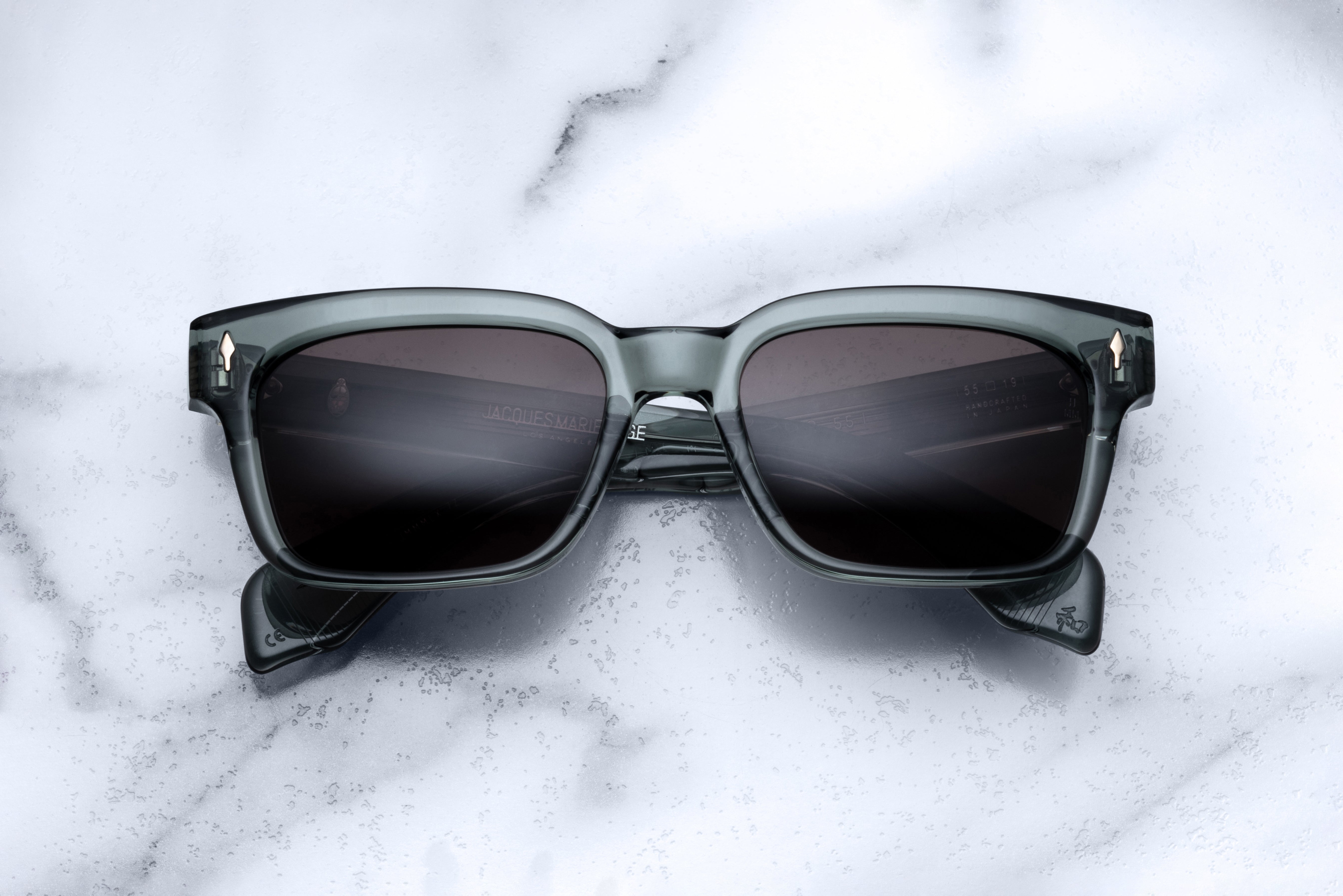Jacques Marie Mage Molino 55 sunglasses with Juniper-colored frames, front view showing stylish design and clear lenses.