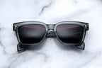 Jacques Marie Mage Molino 55 sunglasses with Juniper-colored frames and clear lenses, front view with sleek design.