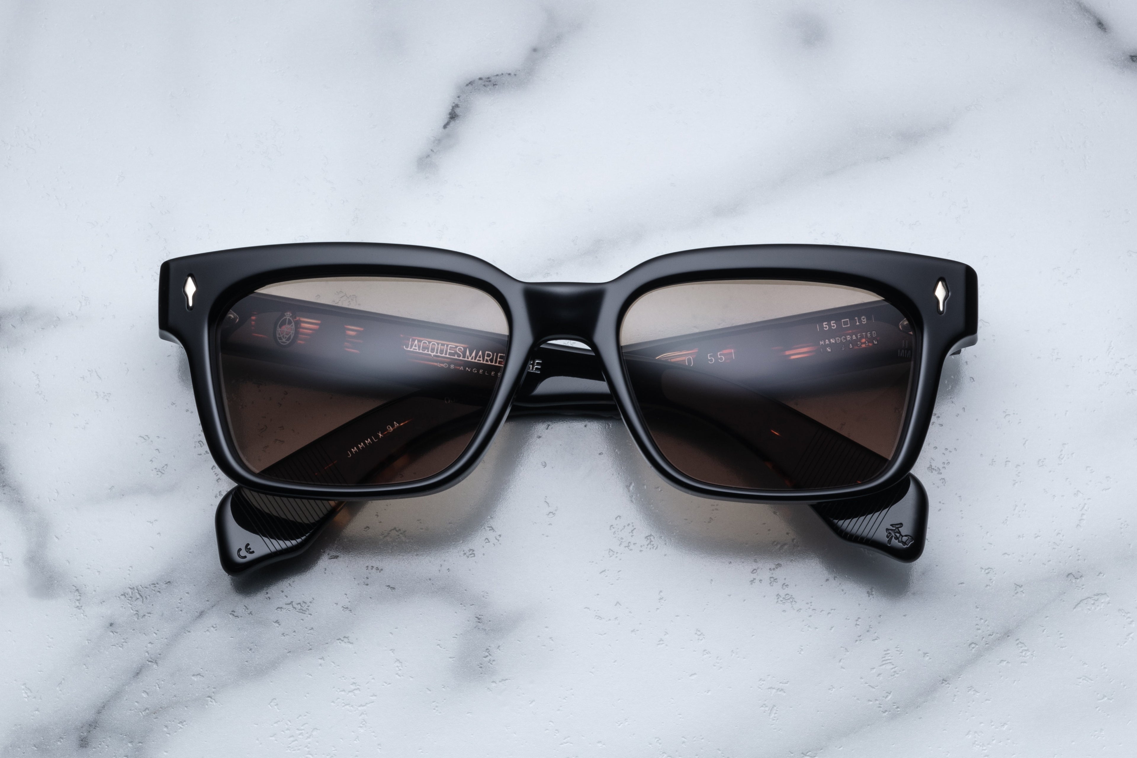 Jacques Marie Mage Molino 55 sunglasses in matte black, front view showcasing sleek frames and stylish design.