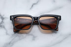 Jacques Marie Mage Molino 55 sunglasses in noir with a front view showing sleek, modern design and tinted lenses.