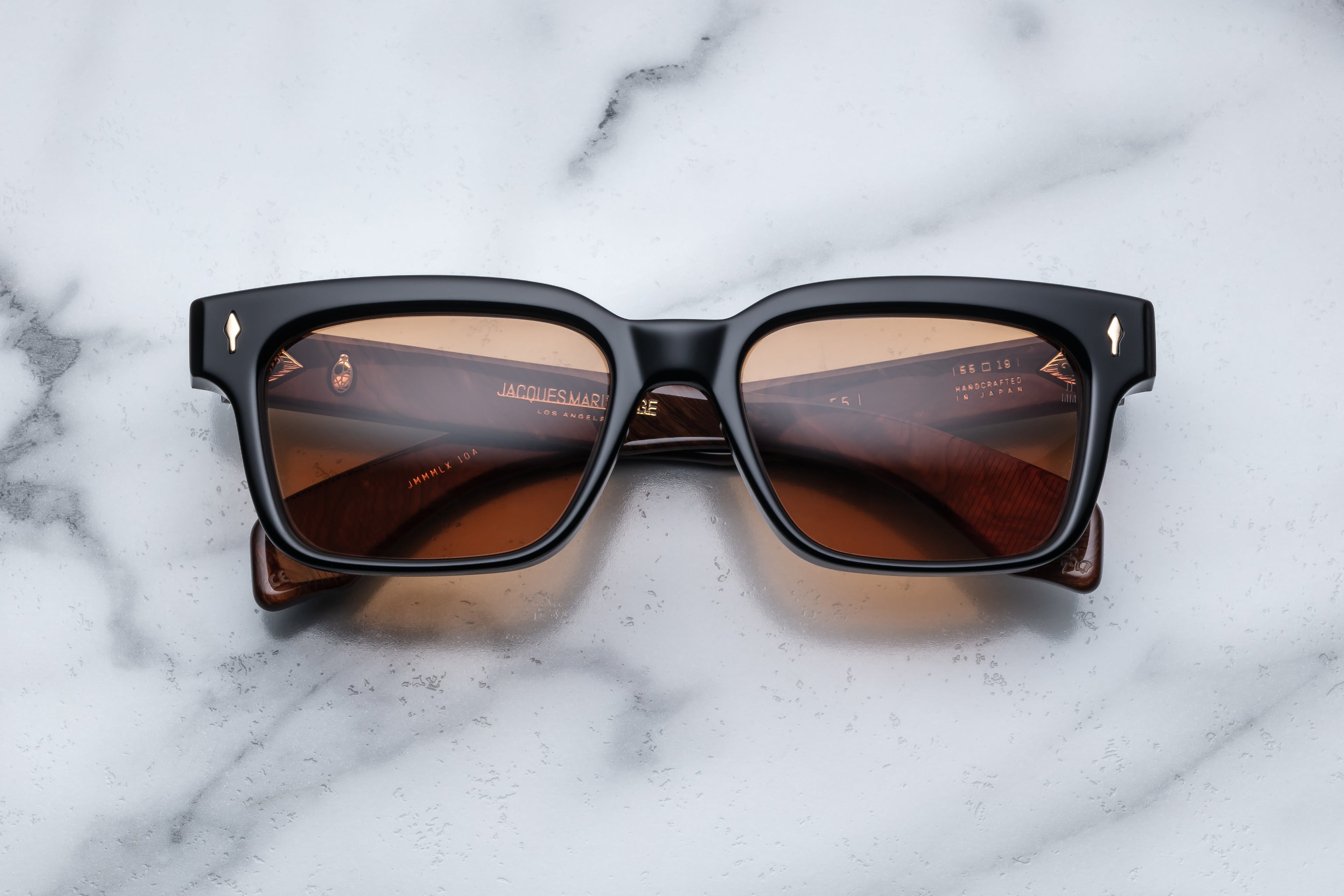 Jacques Marie Mage Molino 55 sunglasses in noir with a front view showing sleek, modern design and tinted lenses.