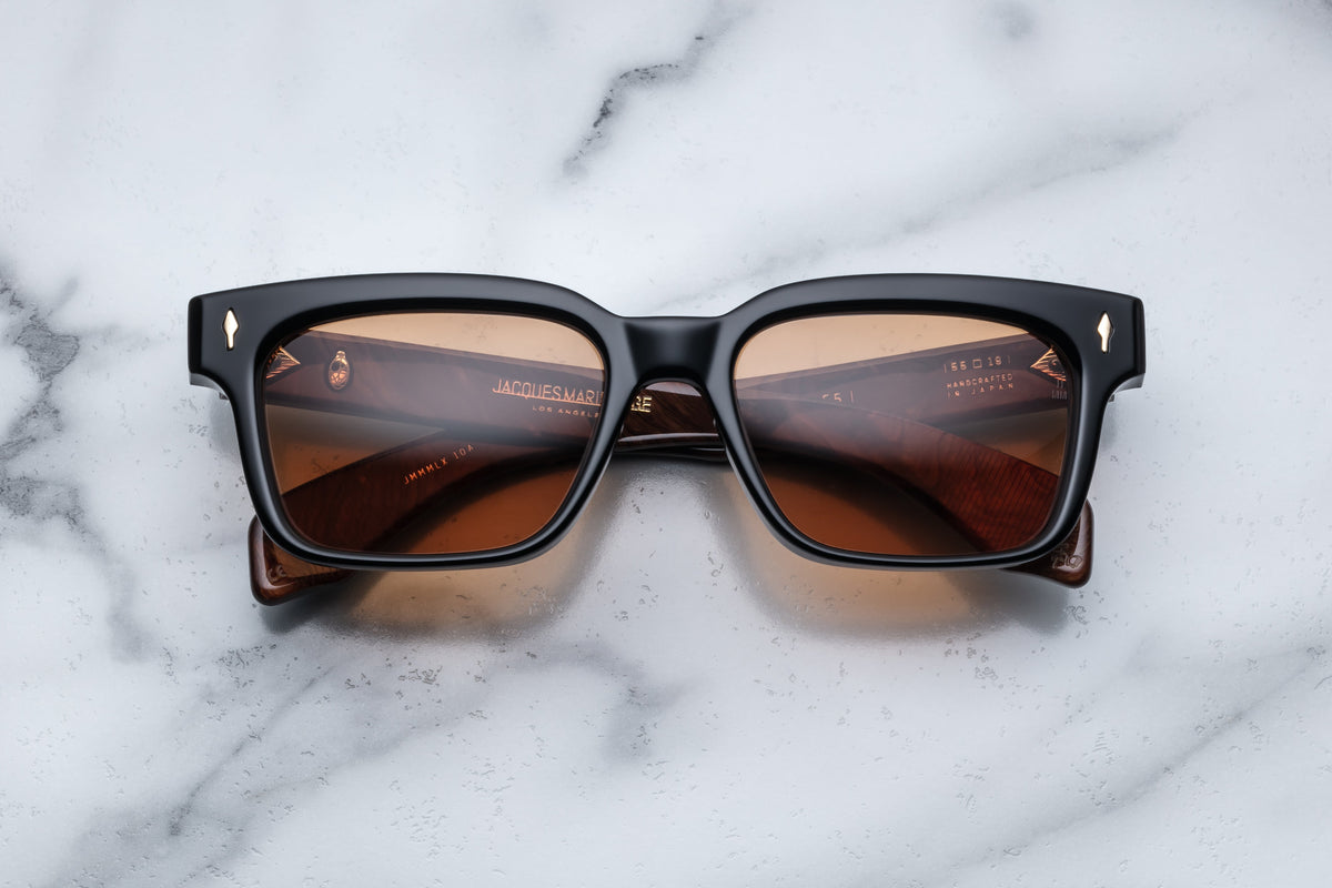 Jacques Marie Mage Molino 55 sunglasses with black frame and clear lenses, front view showing sleek design and modern style.