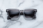 Jacques Marie Mage Molino 55 sunglasses showing the front view with sleek black frames and tinted lenses.