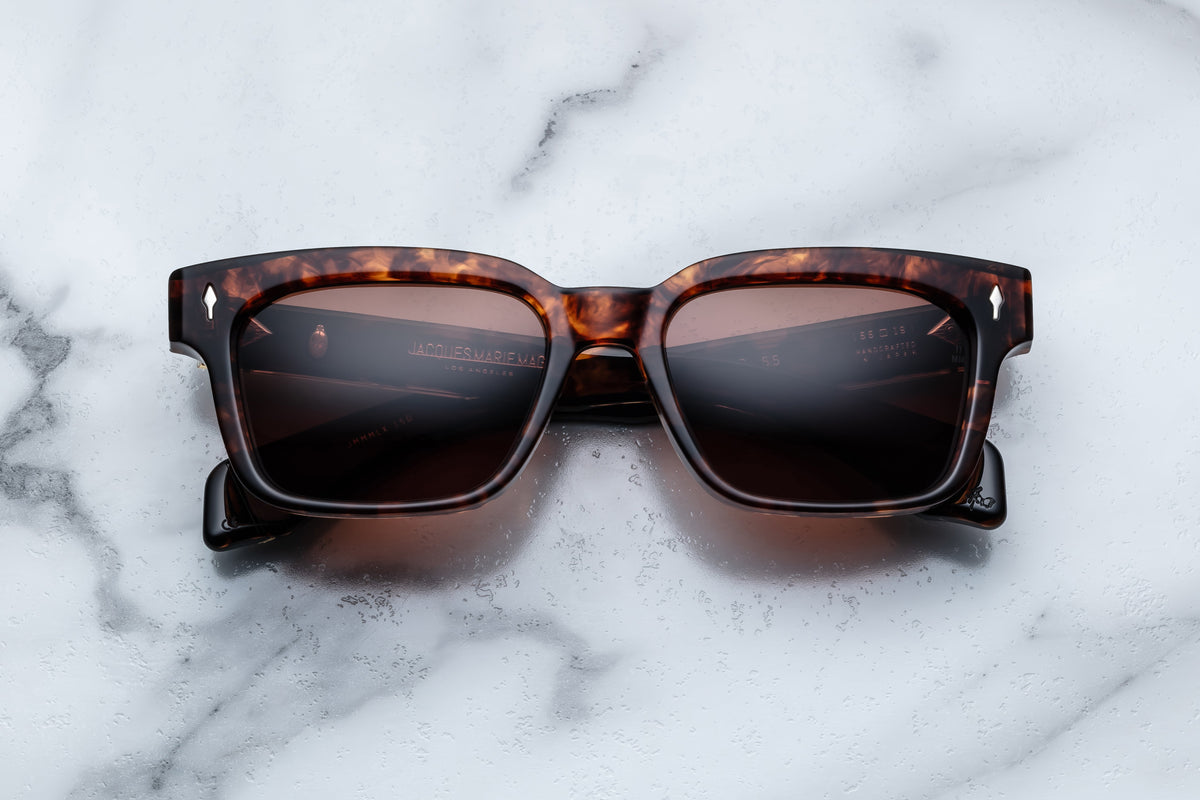 Jacques Marie Mage Molino 55 sunglasses with round frames and dark lenses, front view showing sleek design and brand details