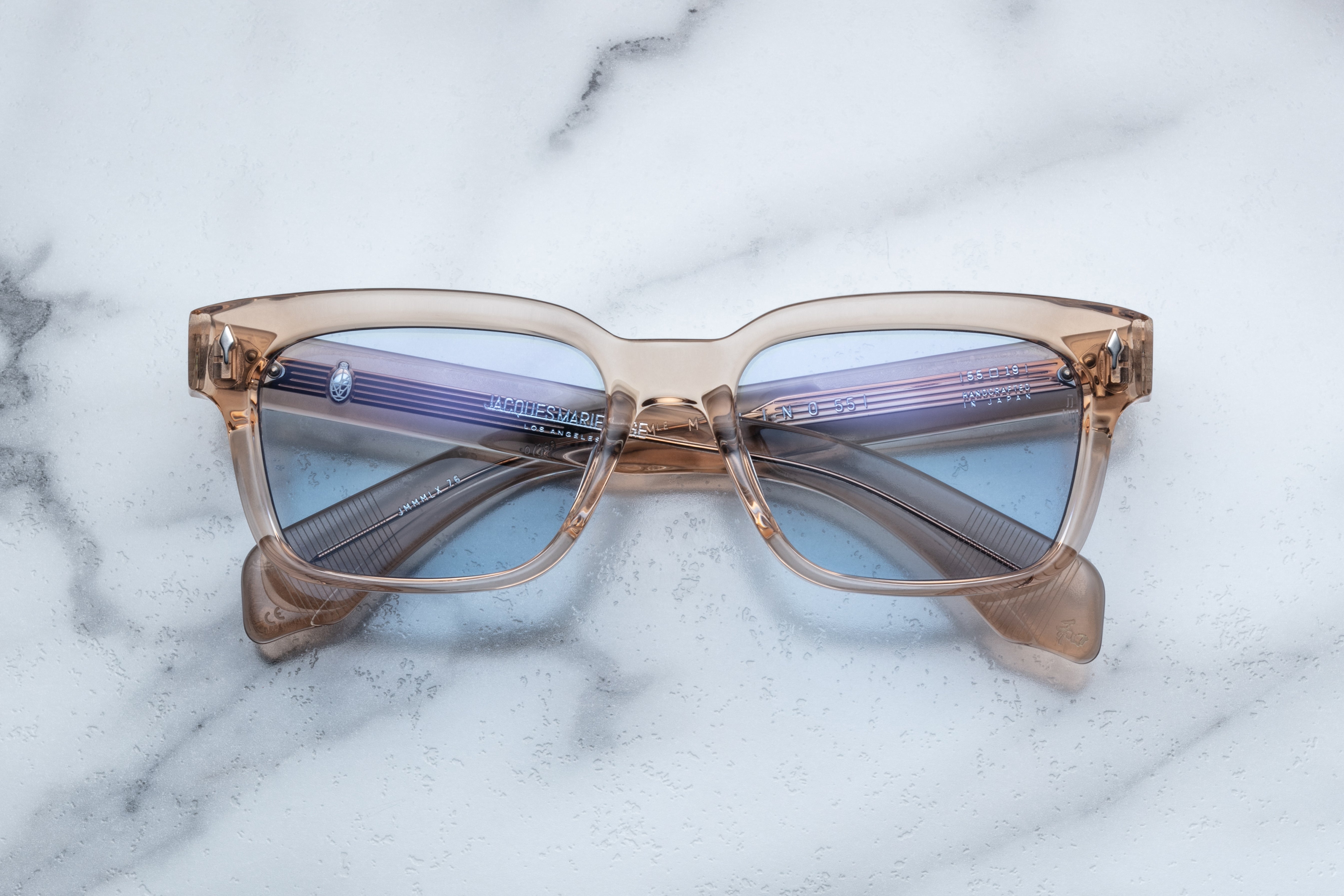 Jacques Marie Mage Molino 55 sunglasses with sand-colored frames and clear lenses, front view showing stylish design.