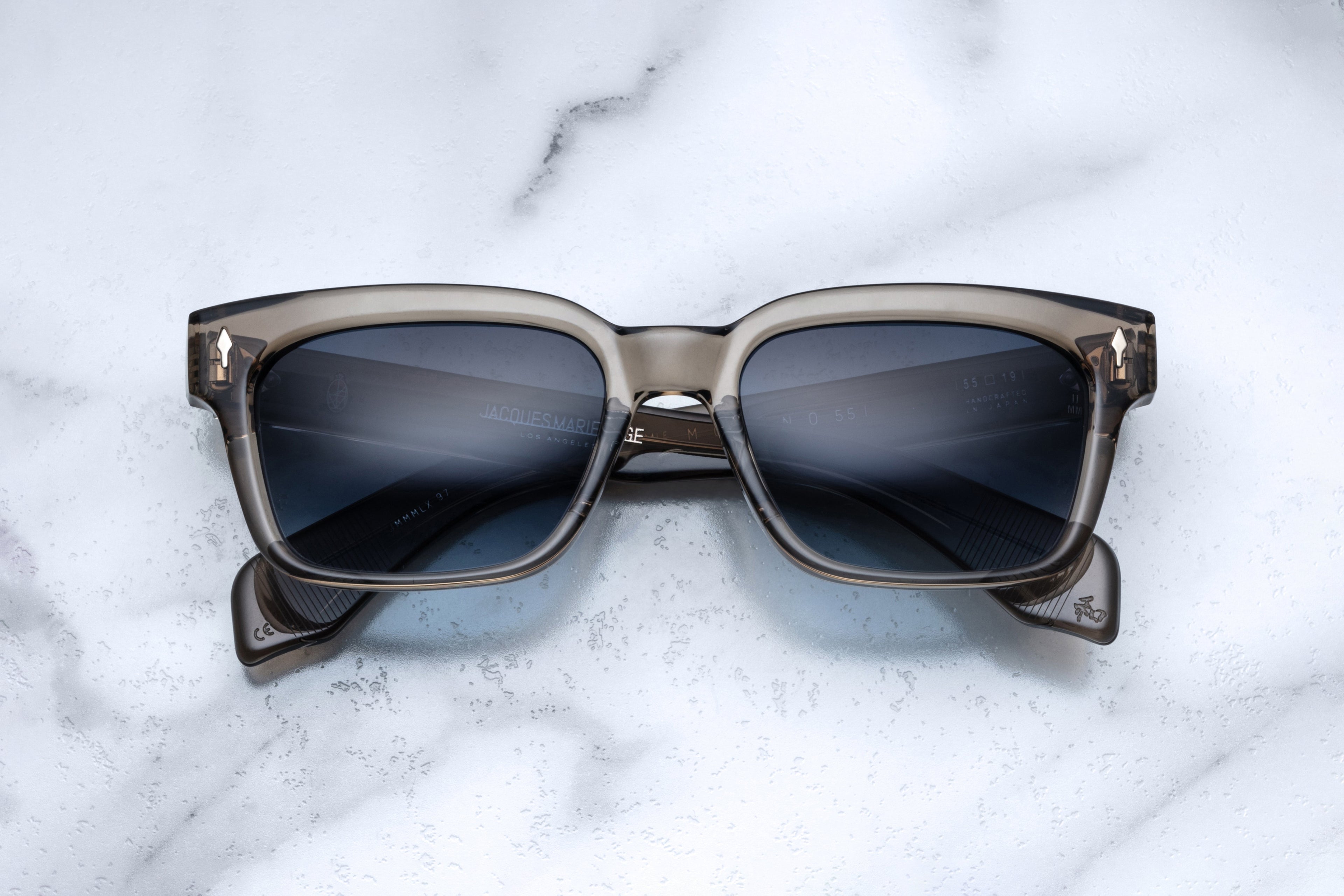 Jacques Marie Mage Molino 55 taupe sunglasses with round frames and tinted lenses, front view showing classic design.
