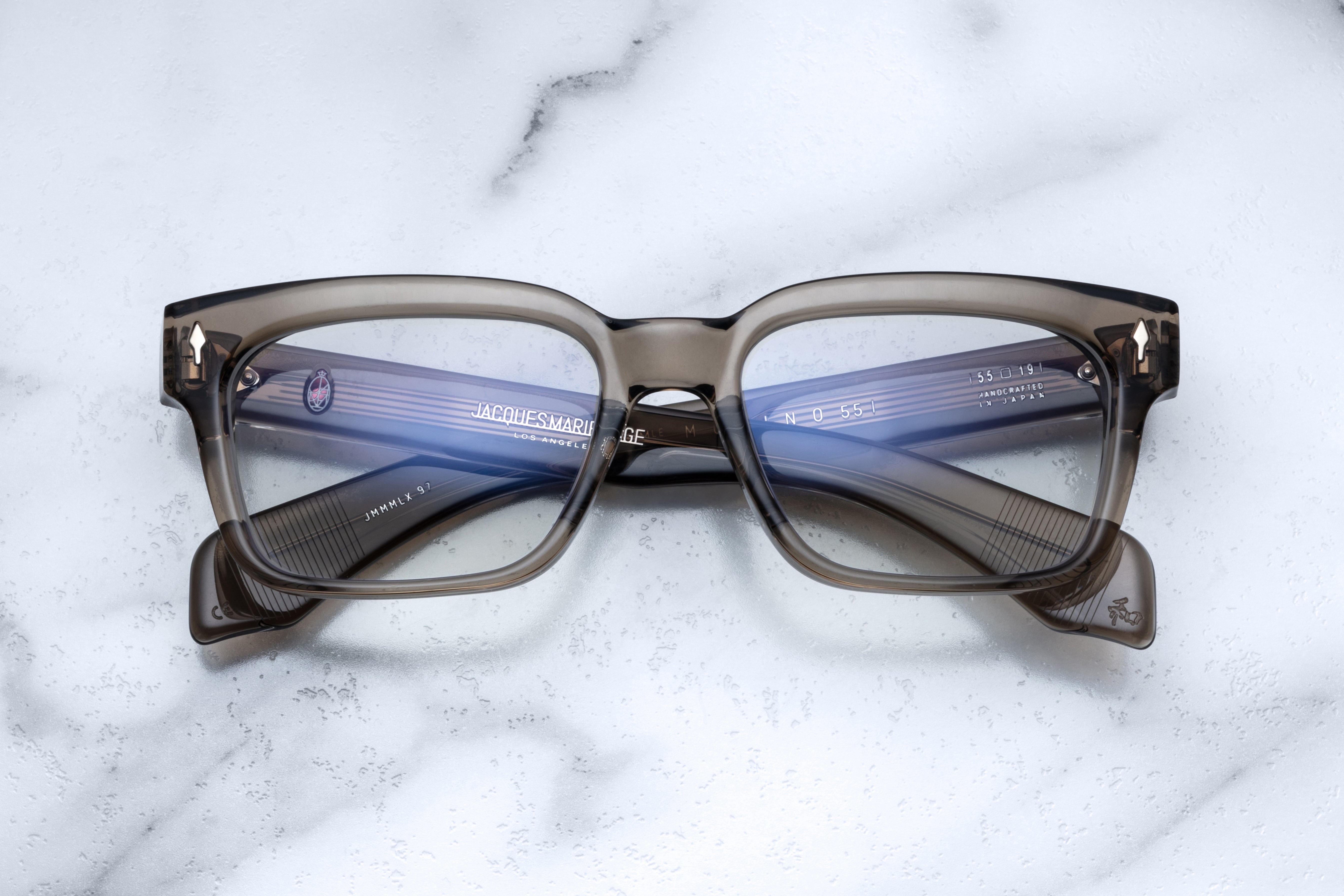 Optical glasses frame MOLINO 55 by Jacques Marie Mage in taupe color, front view showing sleek design and clear lenses.