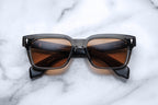 Jacques Marie Mage Molino 55 sunglasses with a sleek black frame and tinted lenses, front view showing modern design.