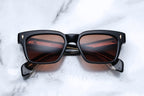 Jacques Marie Mage Molino Beluga sunglasses with round frames and dark tinted lenses, front view showing sleek design.