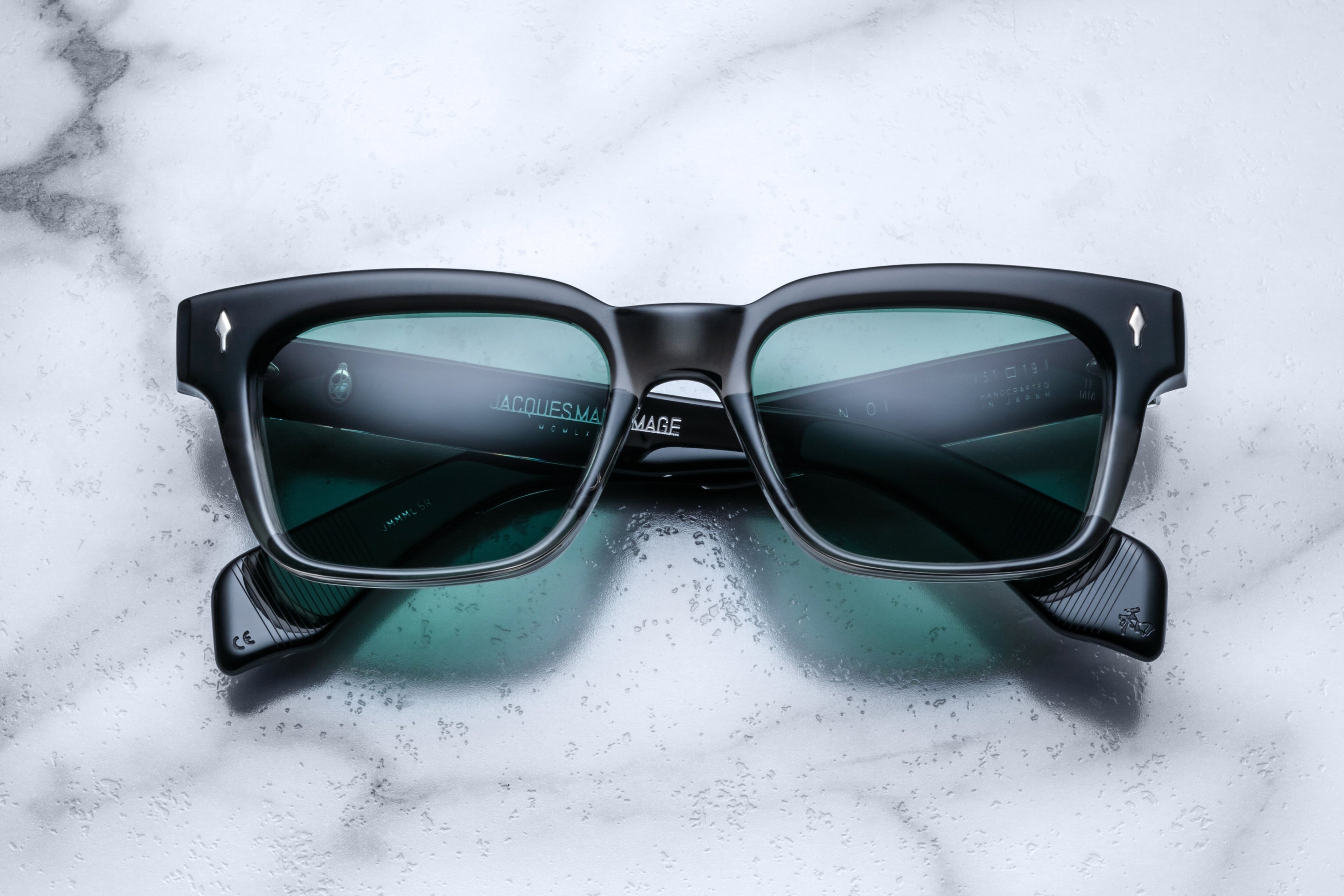 Jacques Marie Mage Molino black fade sunglasses with rounded frames and dark tinted lenses, front view showing stylish design.