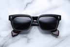 Jacques Marie Mage Molino Bloodstone sunglasses with round frames and clear lenses, shown from the front view.