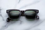 Jacques Marie Mage Molino sunglasses with sleek front view, showcasing modern design and stylish black frames.