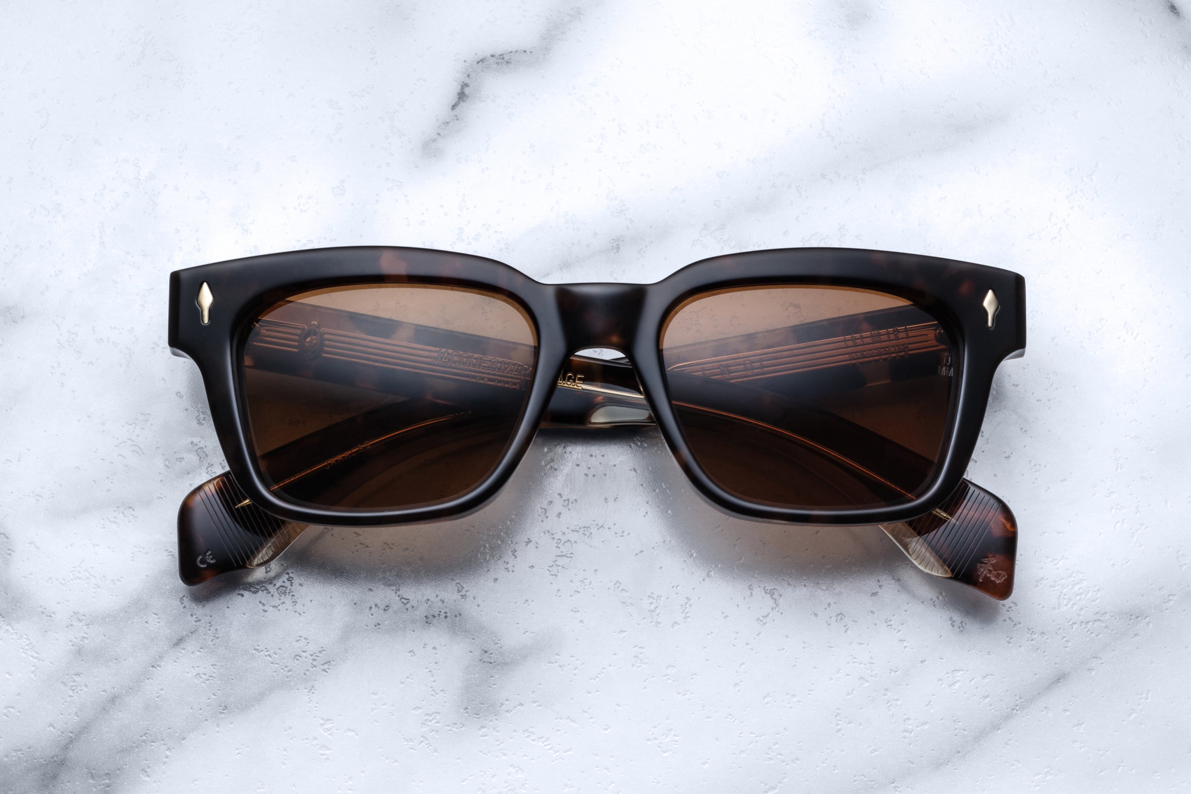 Jacques Marie Mage Molino Havana sunglasses with rounded frames and dark tinted lenses, front view showing stylish design.