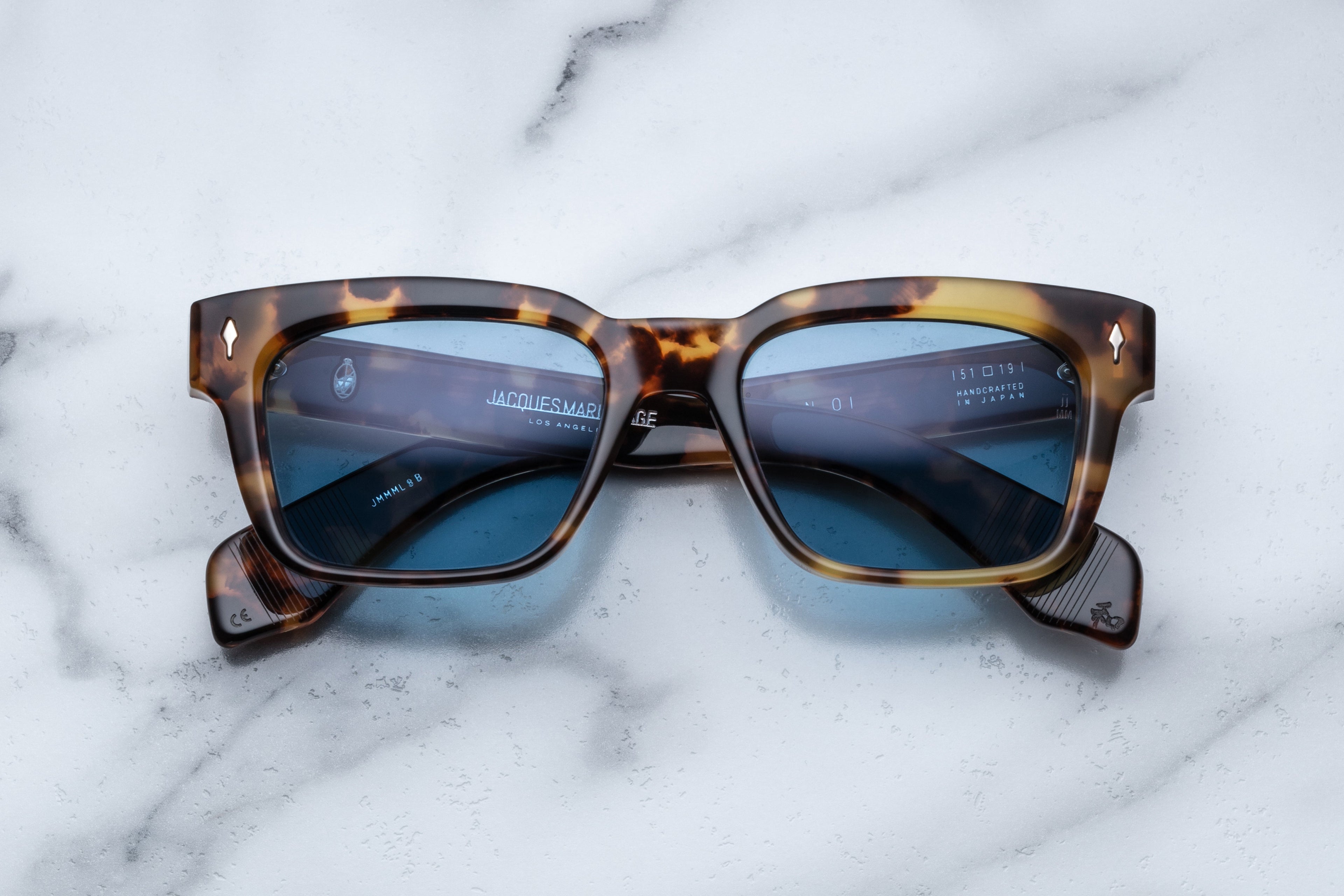 Jacques Marie Mage Molino Havana sunglasses with a sleek front view and warm tortoiseshell frames.