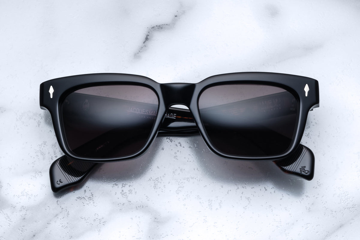 Jacques Marie Mage Molino 55 black sunglasses with rectangular frames and tinted lenses, front view showing sleek design.