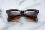 Jacques Marie Mage Molino Noir sunglasses with black frame and clear lenses, front view showing stylish design.