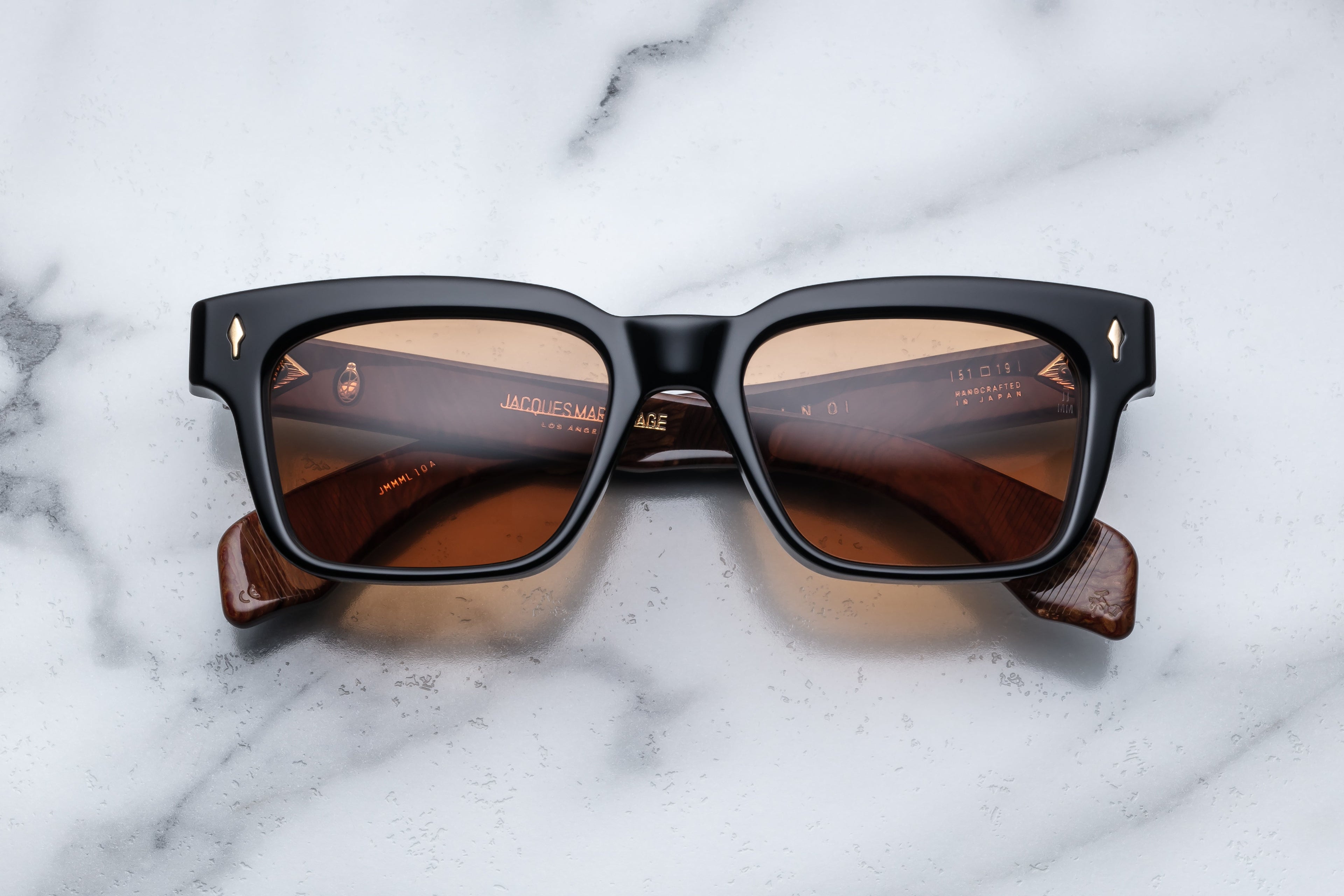 Jacques Marie Mage Molino Noir sunglasses with black frame and clear lenses, front view showing stylish design.