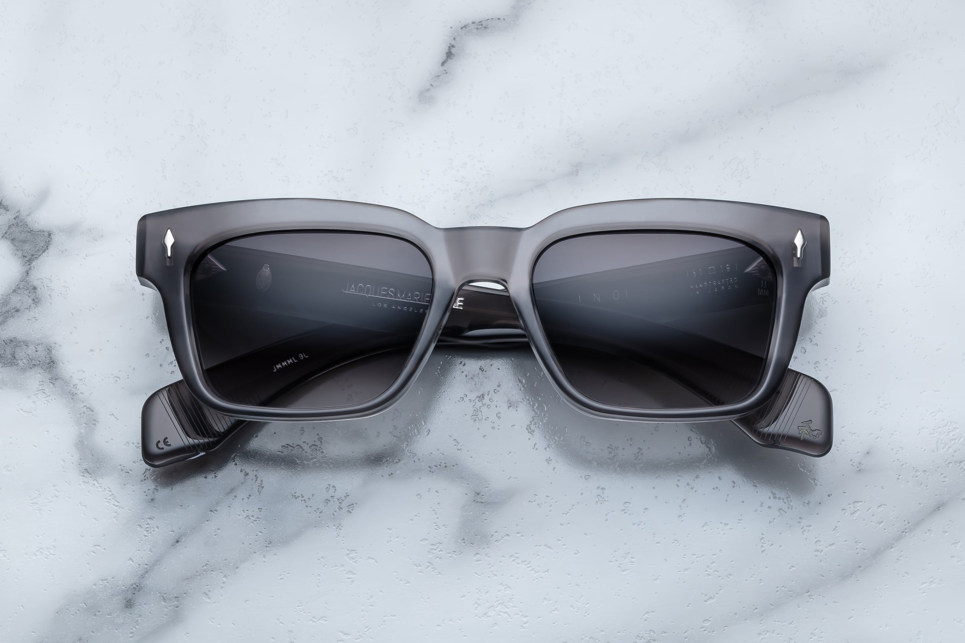 Jacques Marie Mage Molino sunglasses with a sleek front view, featuring dark tinted lenses and stylish frame design.