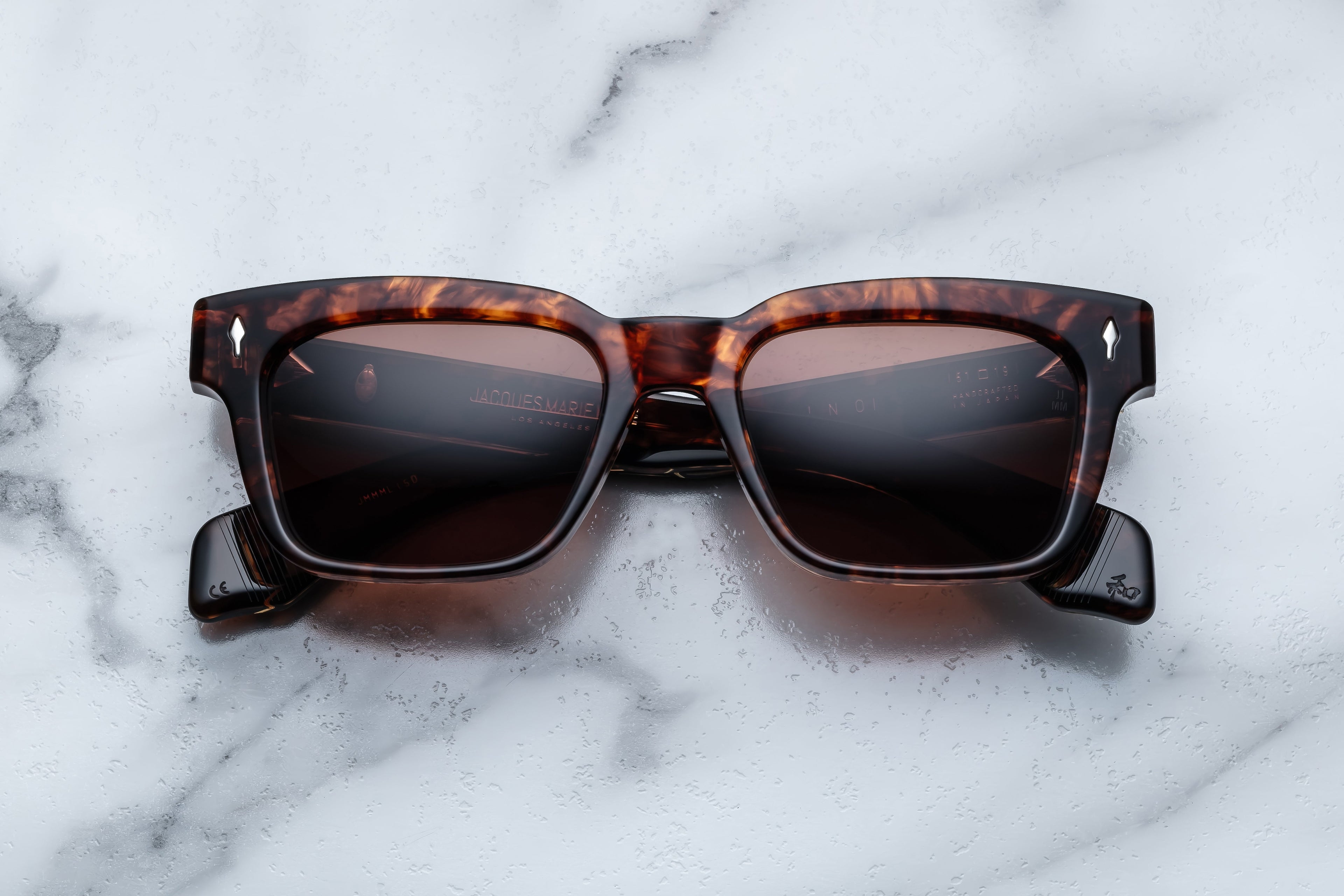 Jacques Marie Mage Molino Samoa sunglasses with rounded frames and dark lenses, shown from the front.