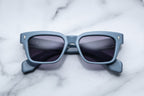 Jacques Marie Mage Molino tiger sunglasses with bold, rounded frames and distinctive tiger pattern on the front.