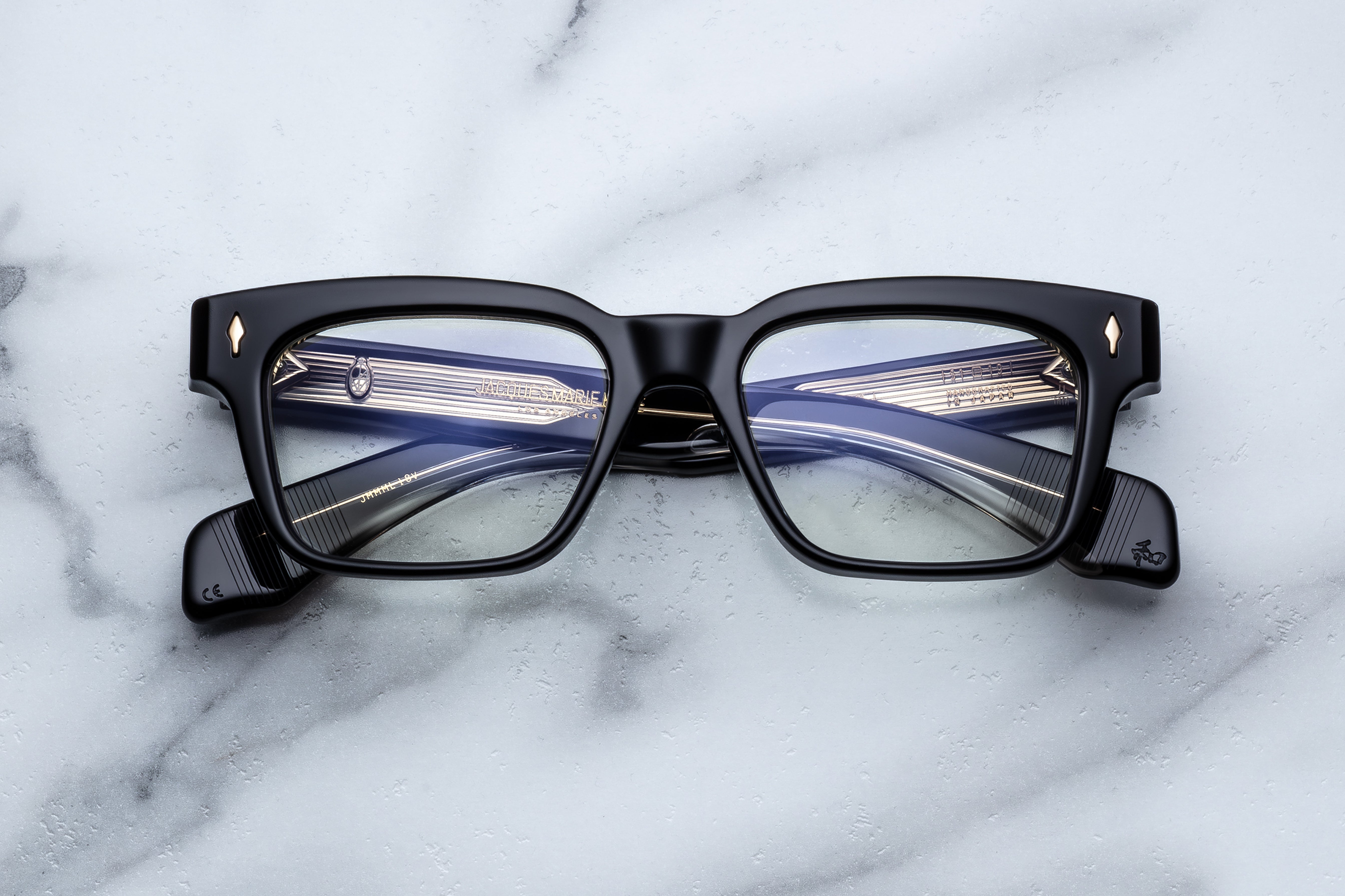 Jacques Marie Mage Molino Venom RX optical glasses with clear lenses and black frames, front view showing stylish design.