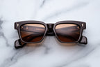 Jacques Marie Mage Molino walnut sunglasses with a sleek front view, showcasing the stylish frame and lens details.