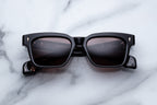 Jacques Marie Mage Molino sunglasses with Willow-colored frames and clear lenses, front view showing stylish eyewear.
