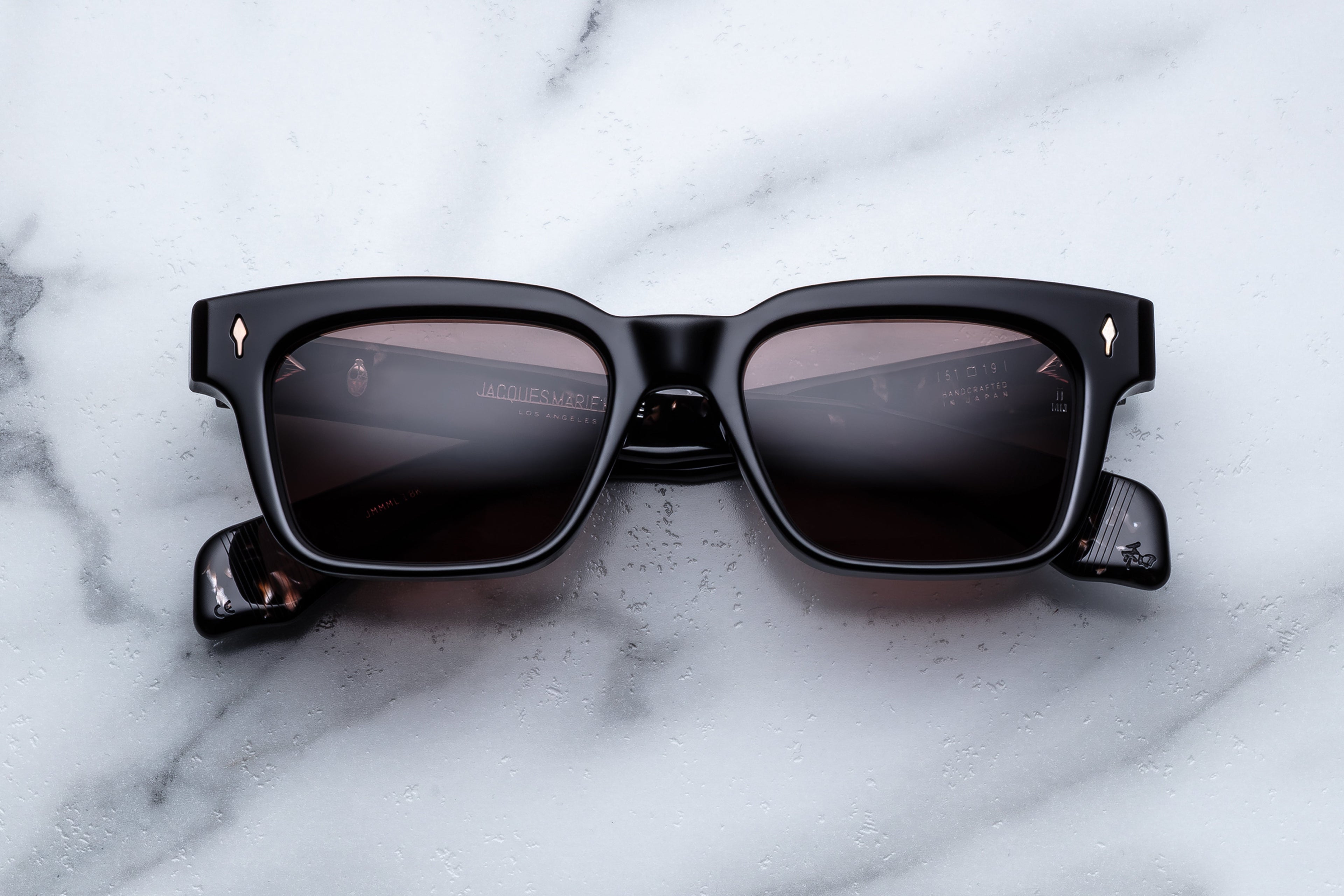 Jacques Marie Mage Molino sunglasses with Willow-colored frames and clear lenses, front view showing stylish eyewear.