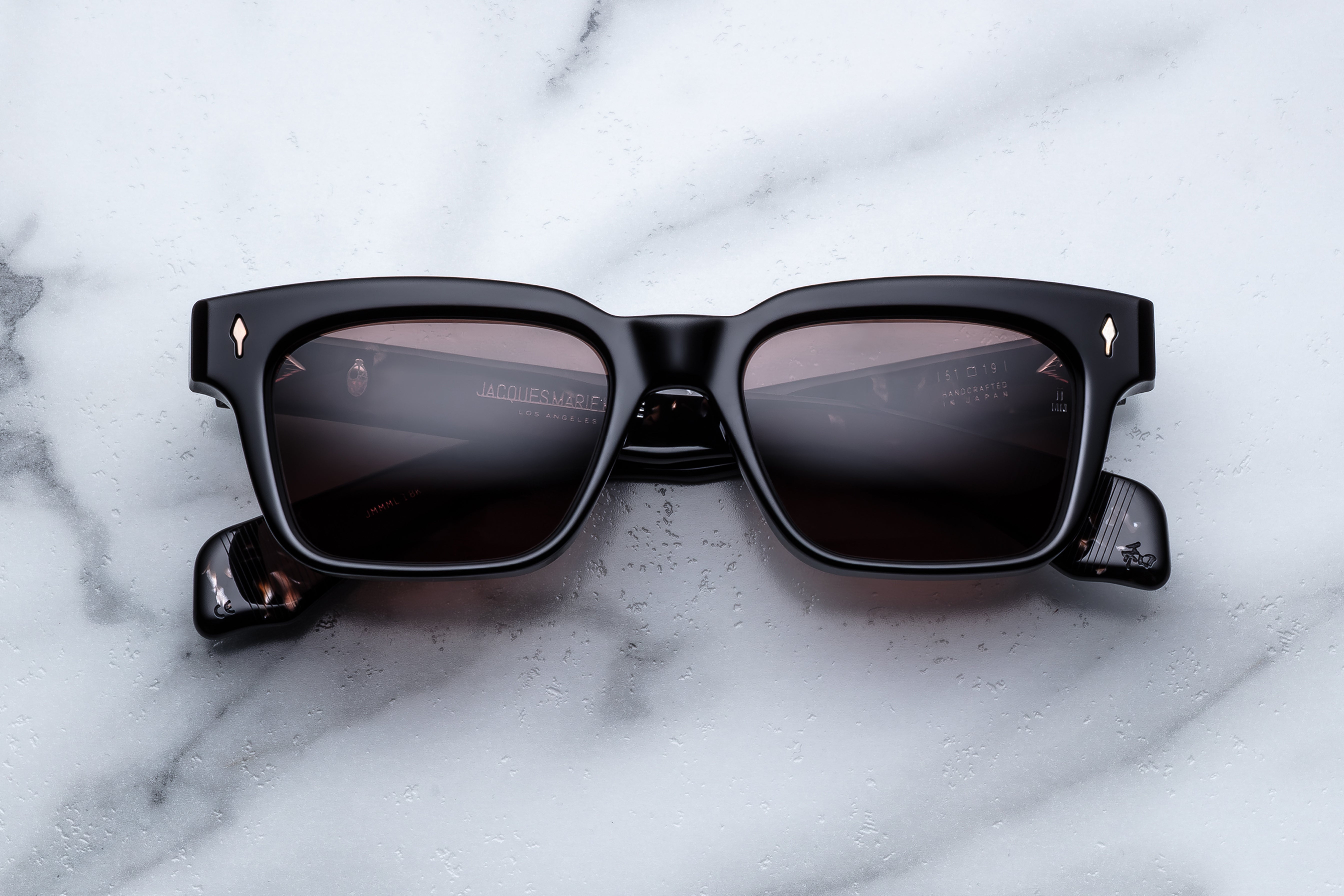 Jacques Marie Mage Molino sunglasses with Willow-colored frames and clear lenses, front view showing stylish eyewear.