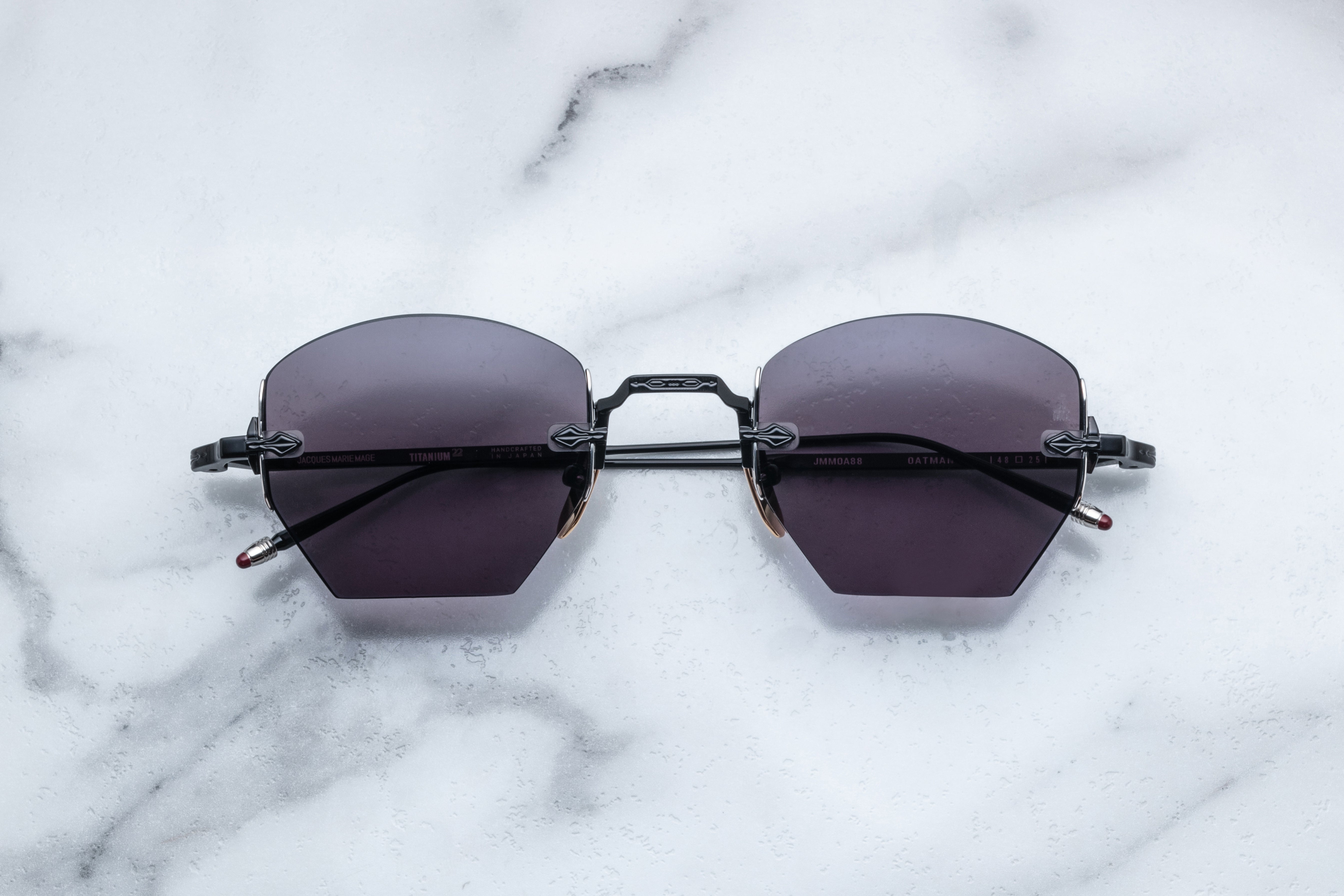 Black Jacques Marie Mage Oatman sunglasses with thick frame and dark lenses, front view showing stylish eyewear.